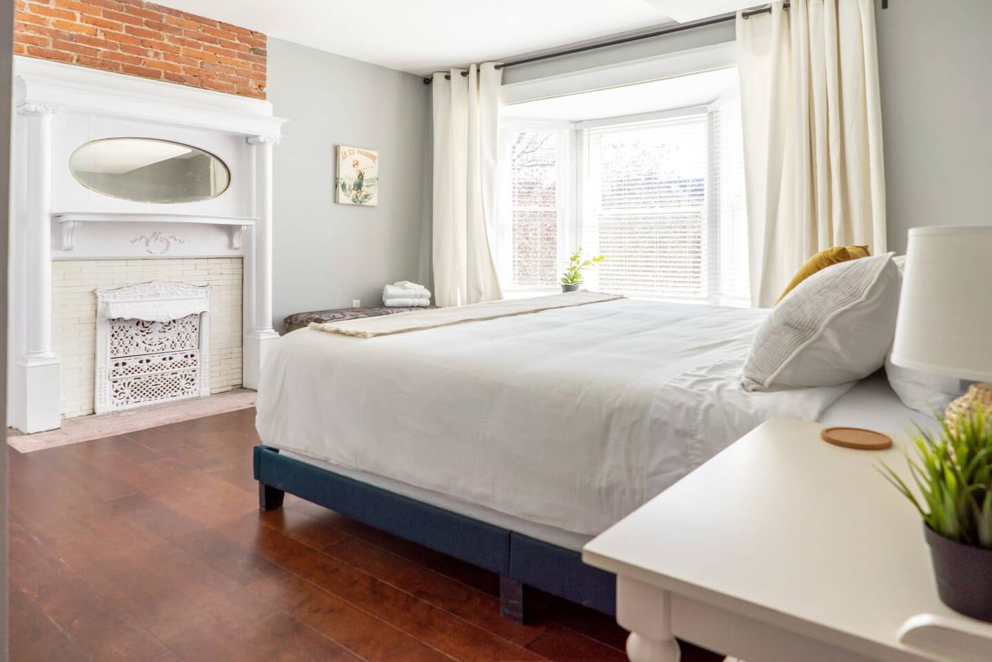 Bedroom one with a luxuriously large king bed and stunning bay window