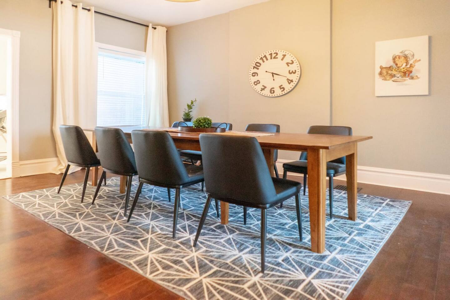 Beautiful, large, wood dining table is perfect for hosting dinner parties