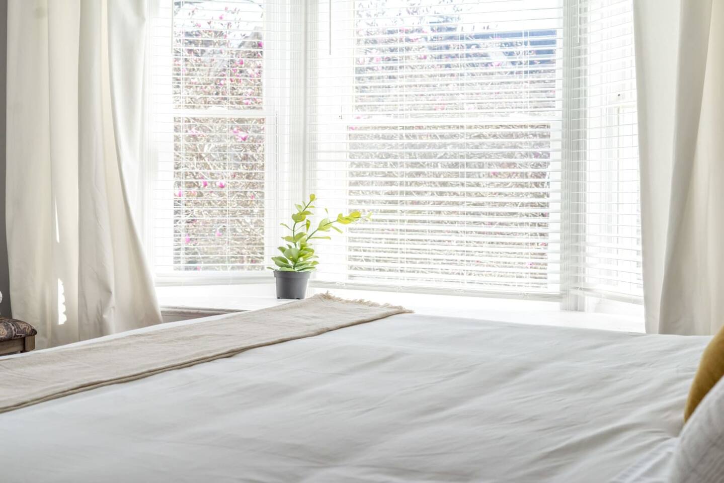 The gorgeous bay windows fill the room with streams of sunlight