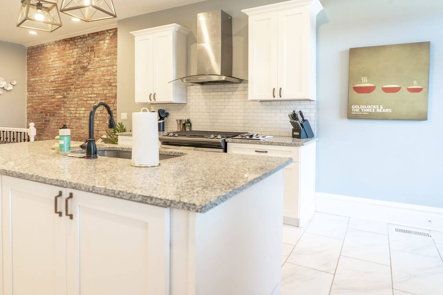 This gorgeous island complete with granite countertops gives the Chef ample preparation space