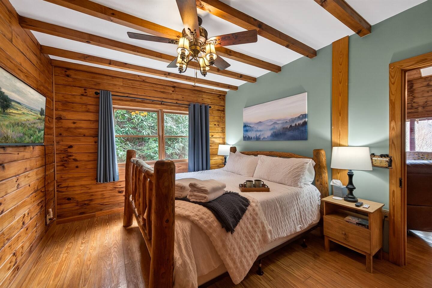 This soft King bedroom awaits your tired body after exploring the Smoky's