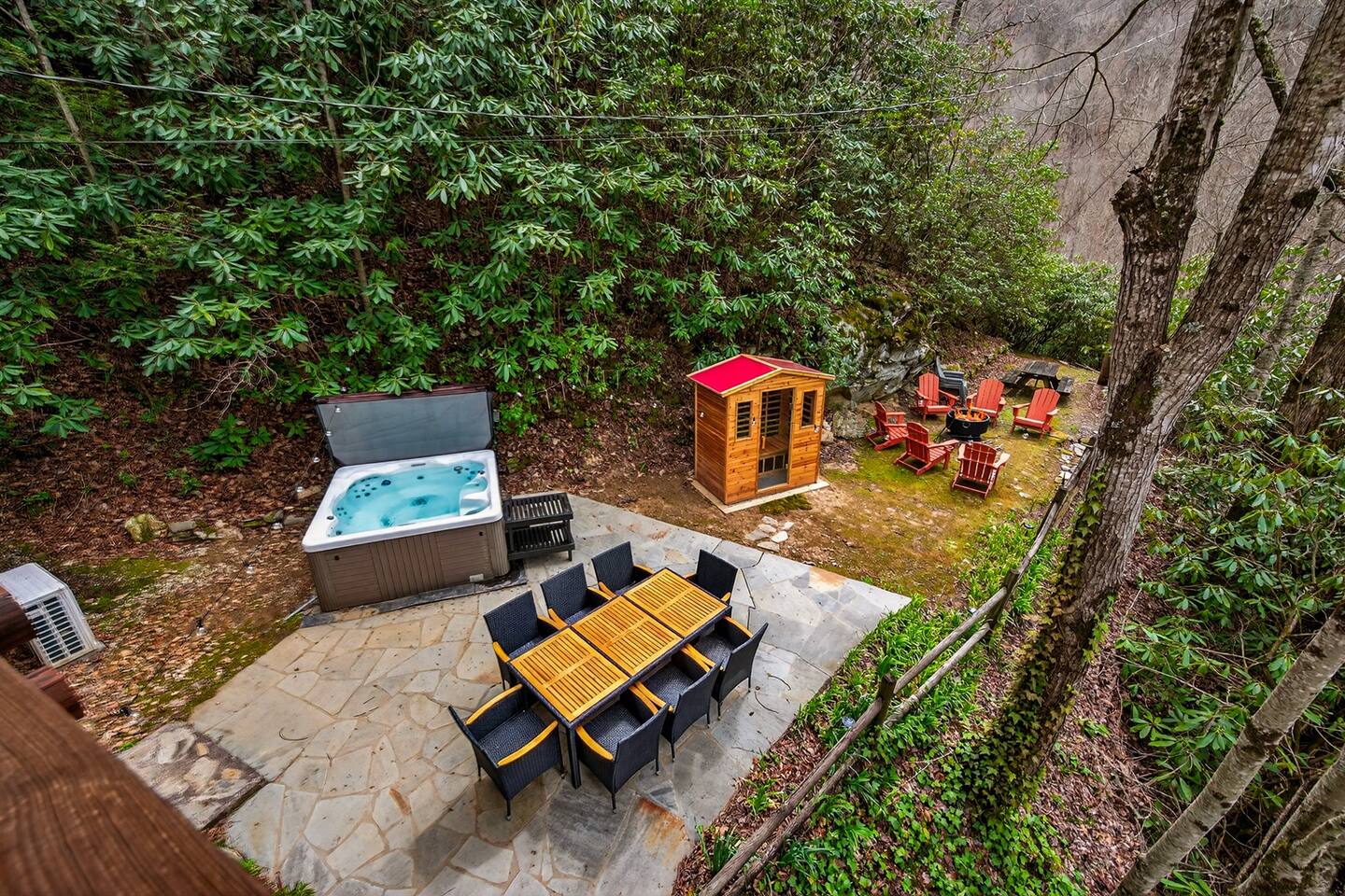 Hot tub, sauna, fire pit and dining area right outside for all the fun anyone could have!