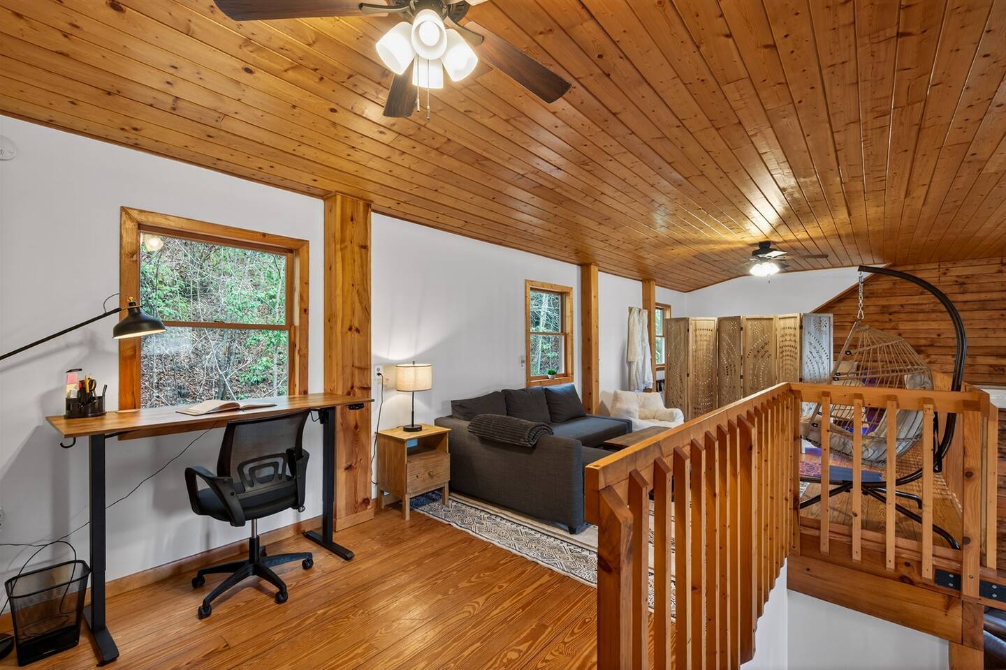 Loft has a desk for working and comfortable reading area.