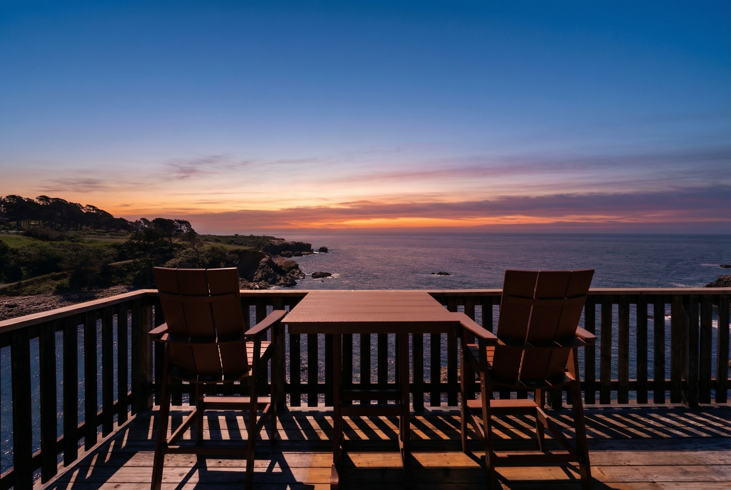 Oceanfront deck with sweeping sunset views—dine above the waves