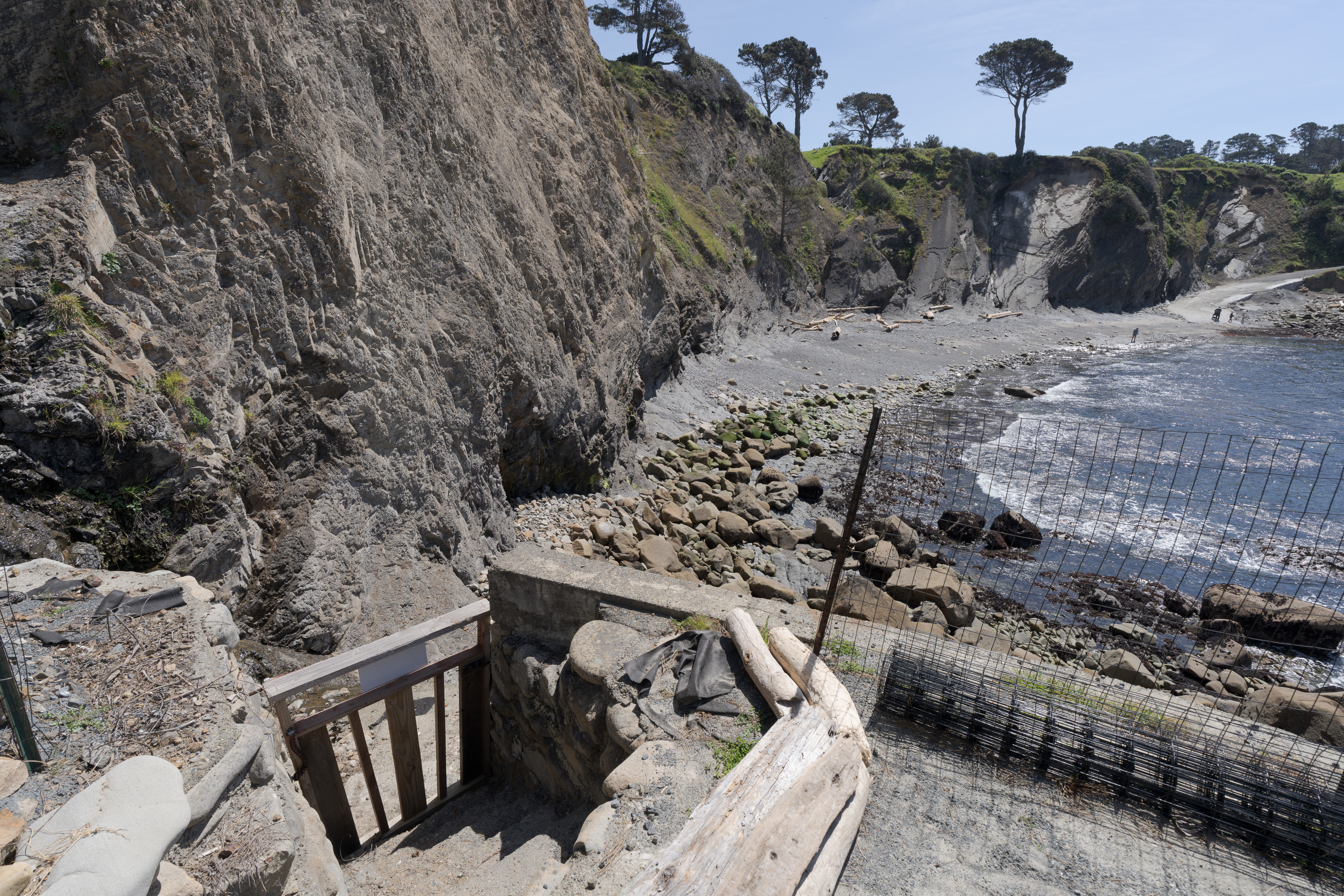 Secluded cove retreat with gated beach access and dramatic ocean cliffs.