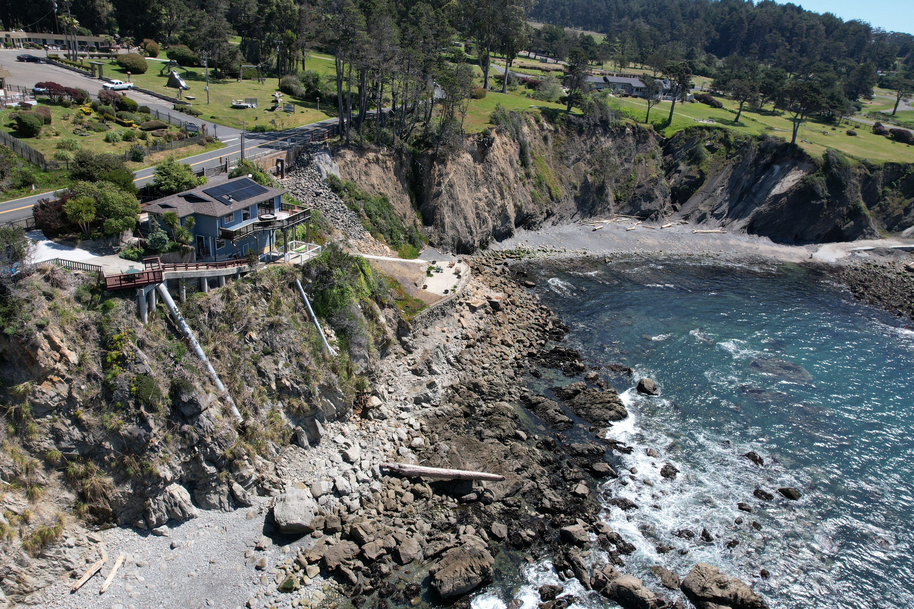 Cliffside retreat with panoramic ocean views above a secluded cove