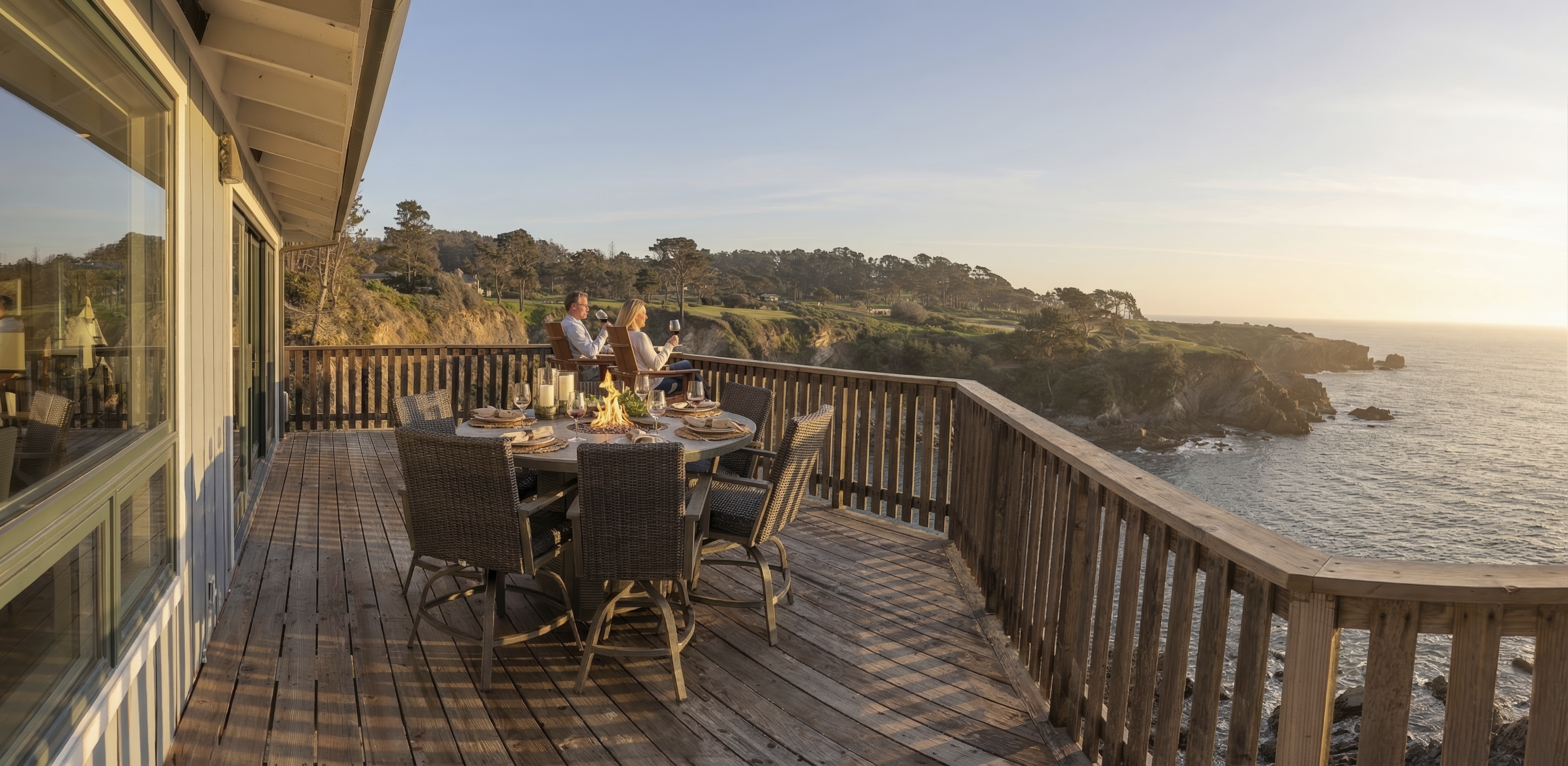 Cliffside deck with fire-table dining and sweeping ocean sunsets.