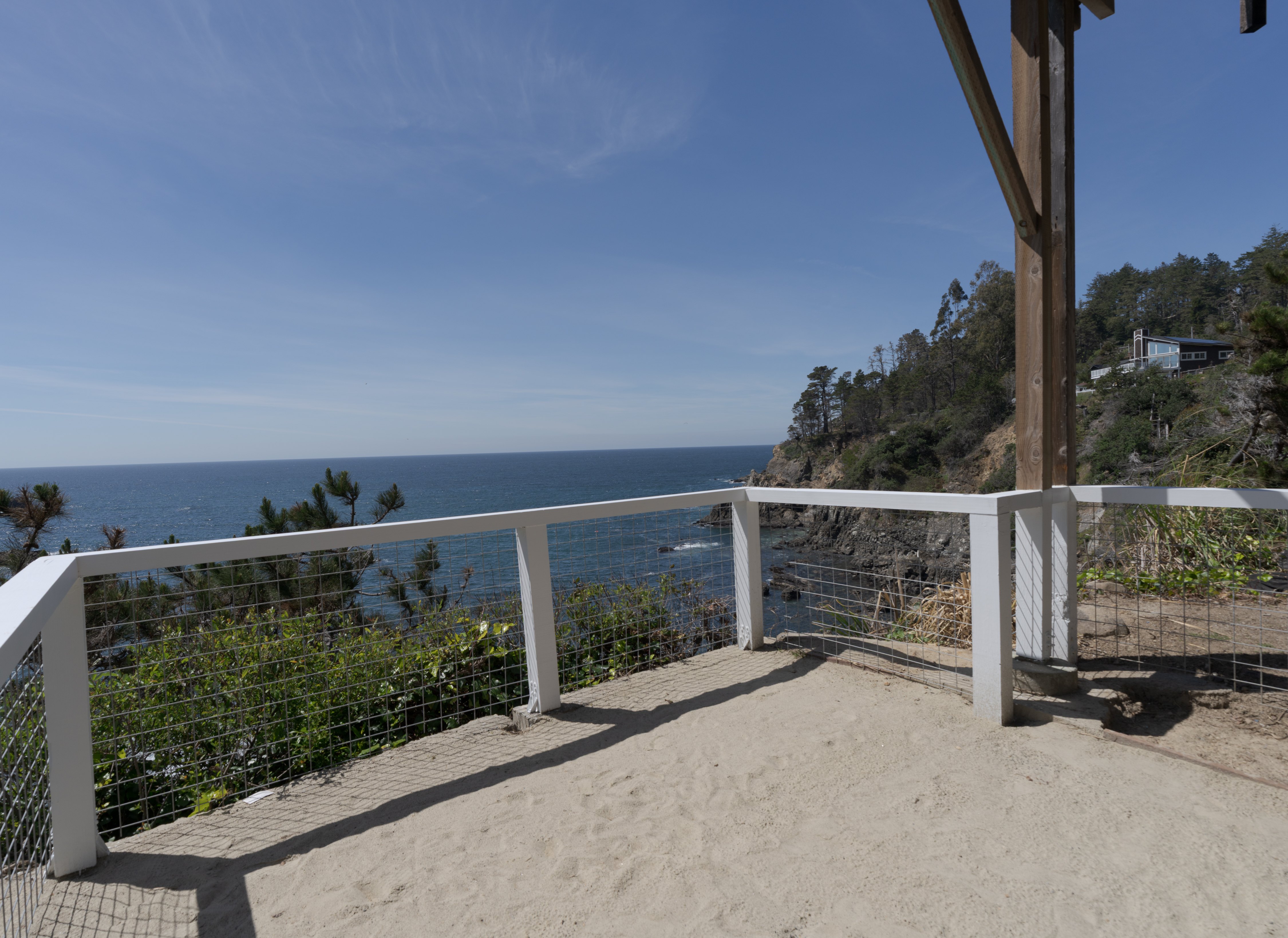 Clifftop deck with sweeping ocean views, perfect for sunsets and morning coffee