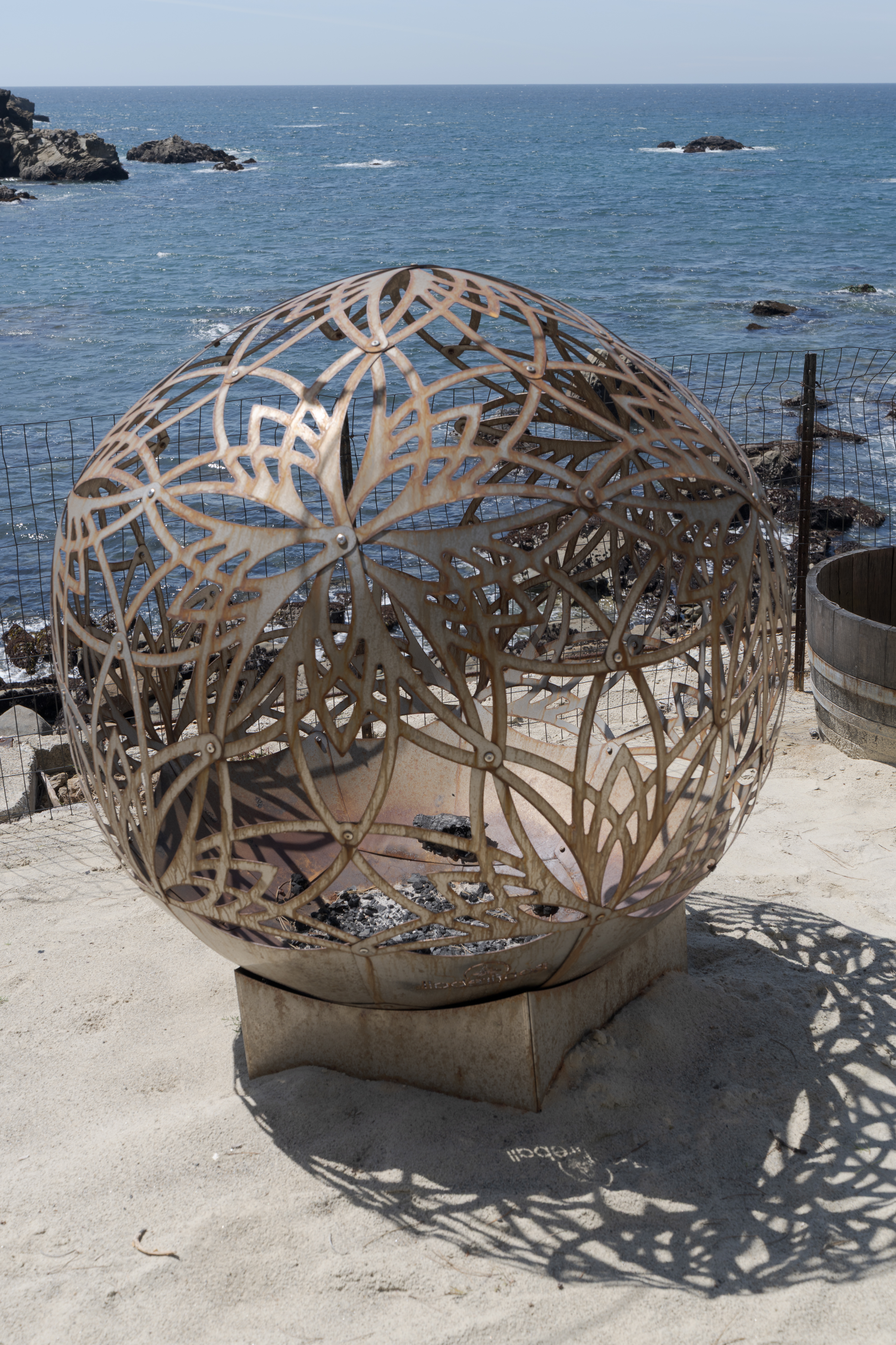 Sculptural seaside fire pit with sweeping coastal views