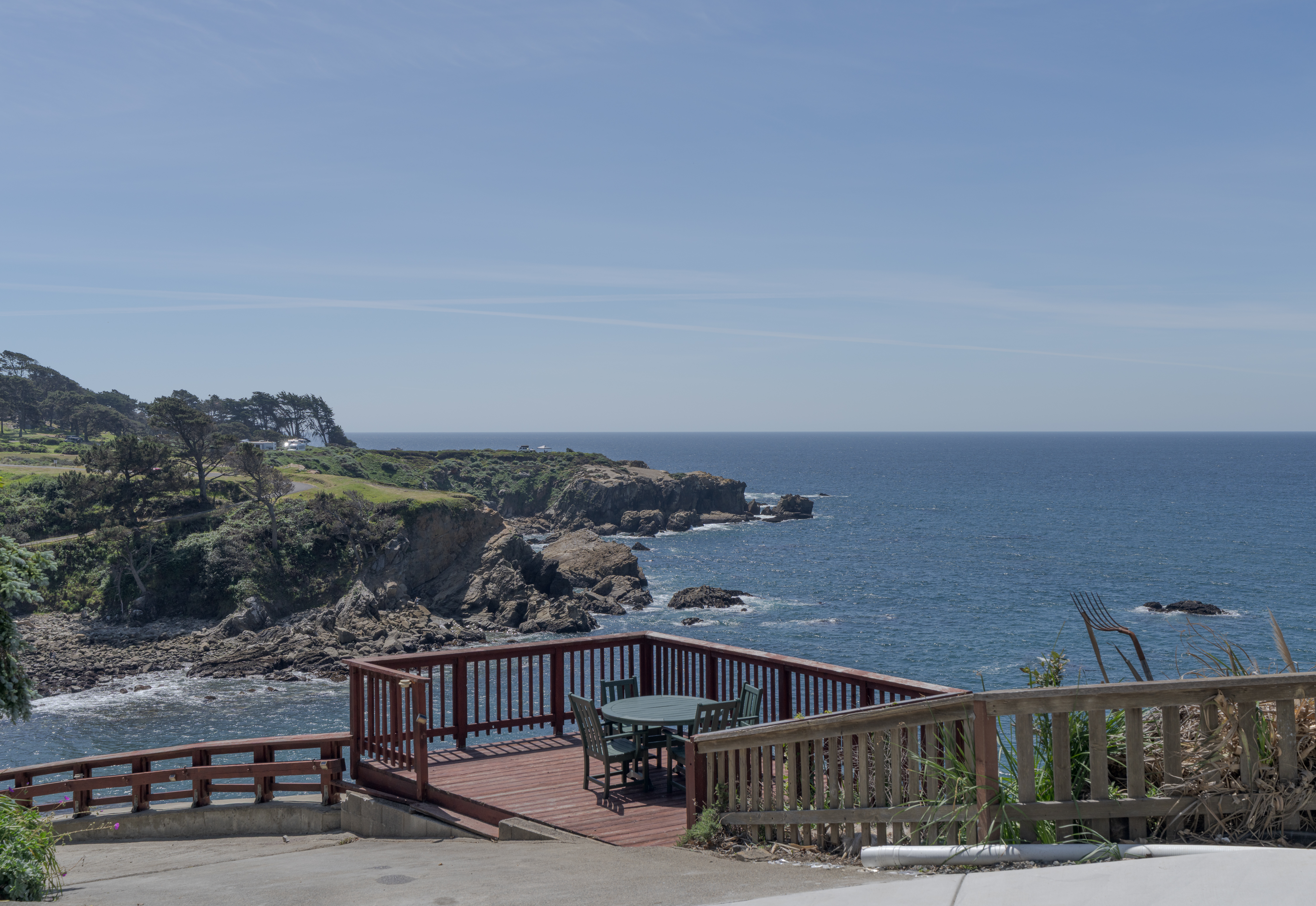 Oceanfront deck with sweeping cliffside views—perfect for sunsets.