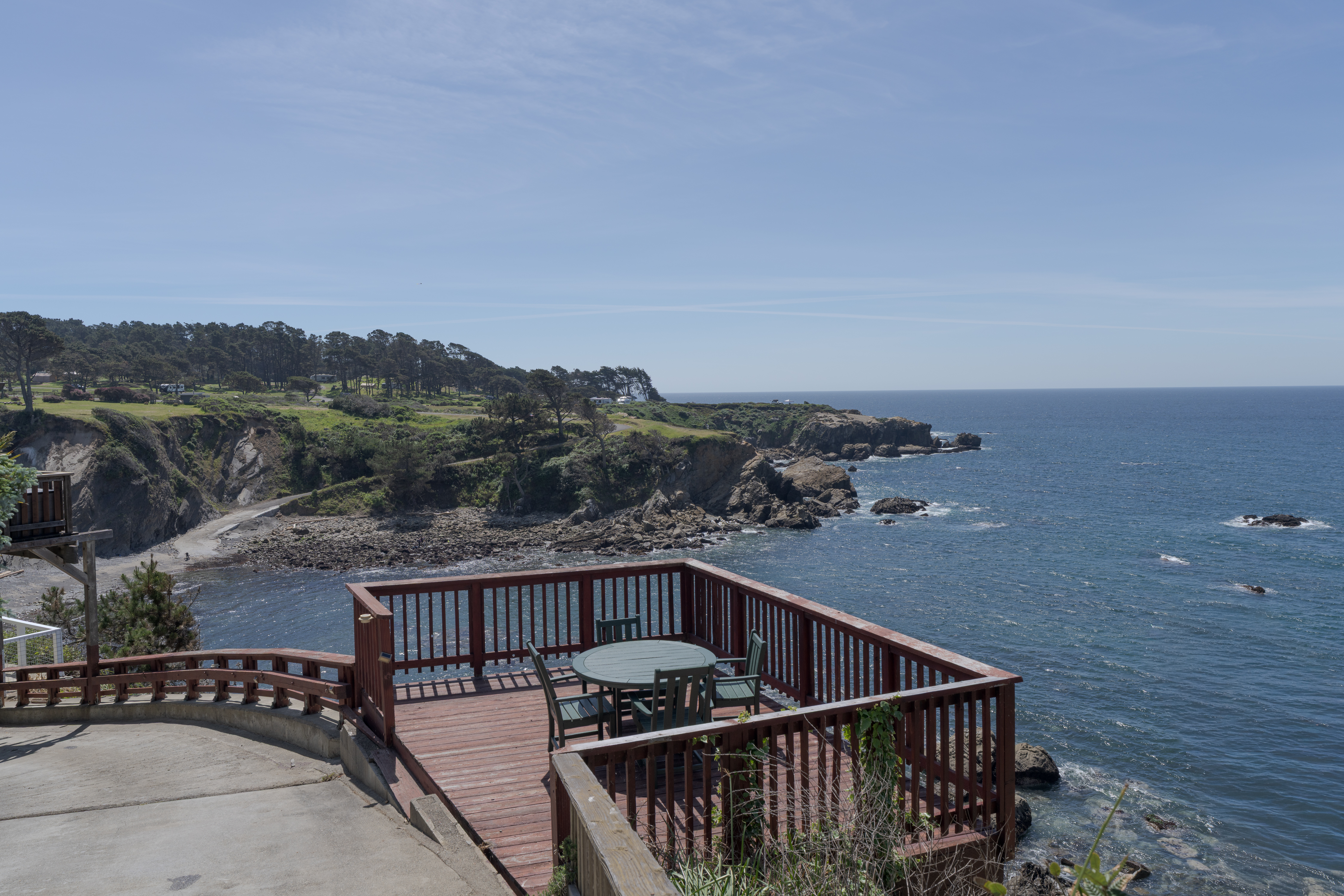 Cliffside deck with sweeping ocean views—perfect for sunset dining
