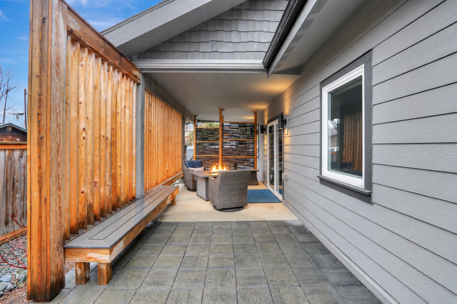 Private covered patio with cozy fire pit lounge seating
