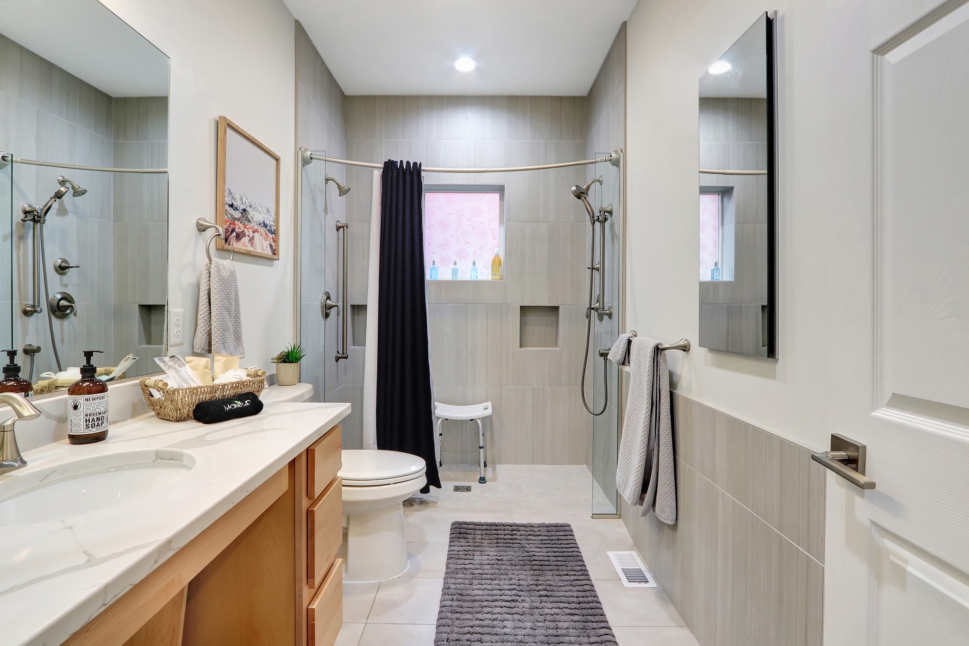 Bright modern bathroom with spacious walk-in shower and upscale finishes
