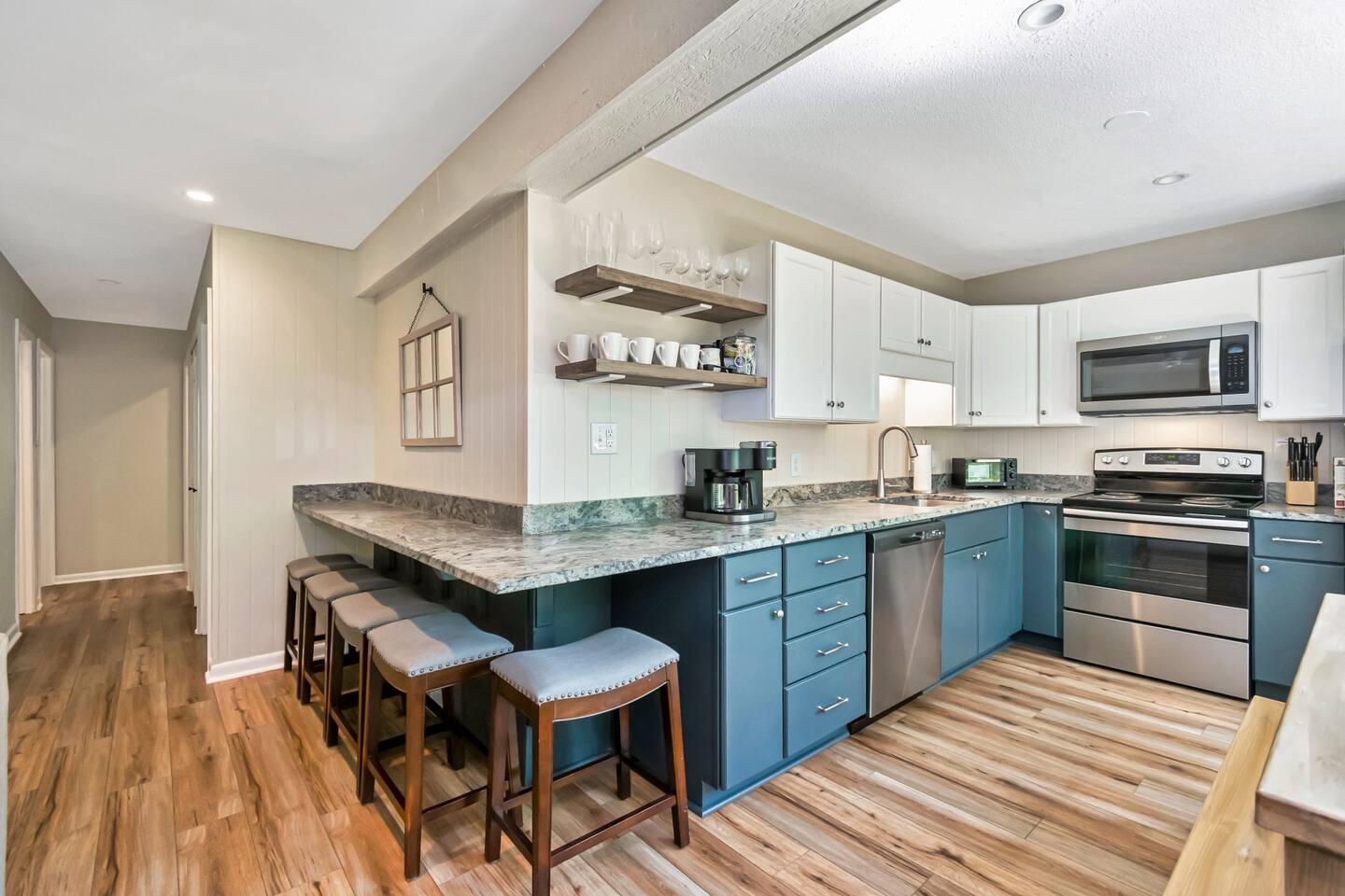 Full kitchen with dishwasher, range and oven