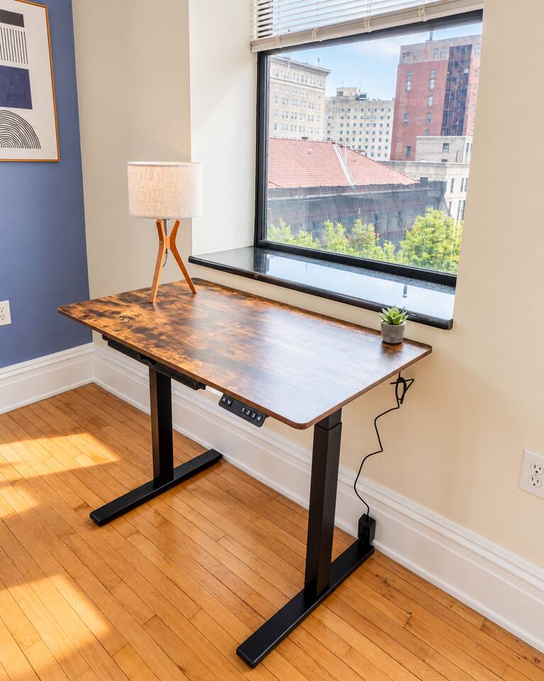 A height-adjustable desk with natural light for long study sessions or video calls.