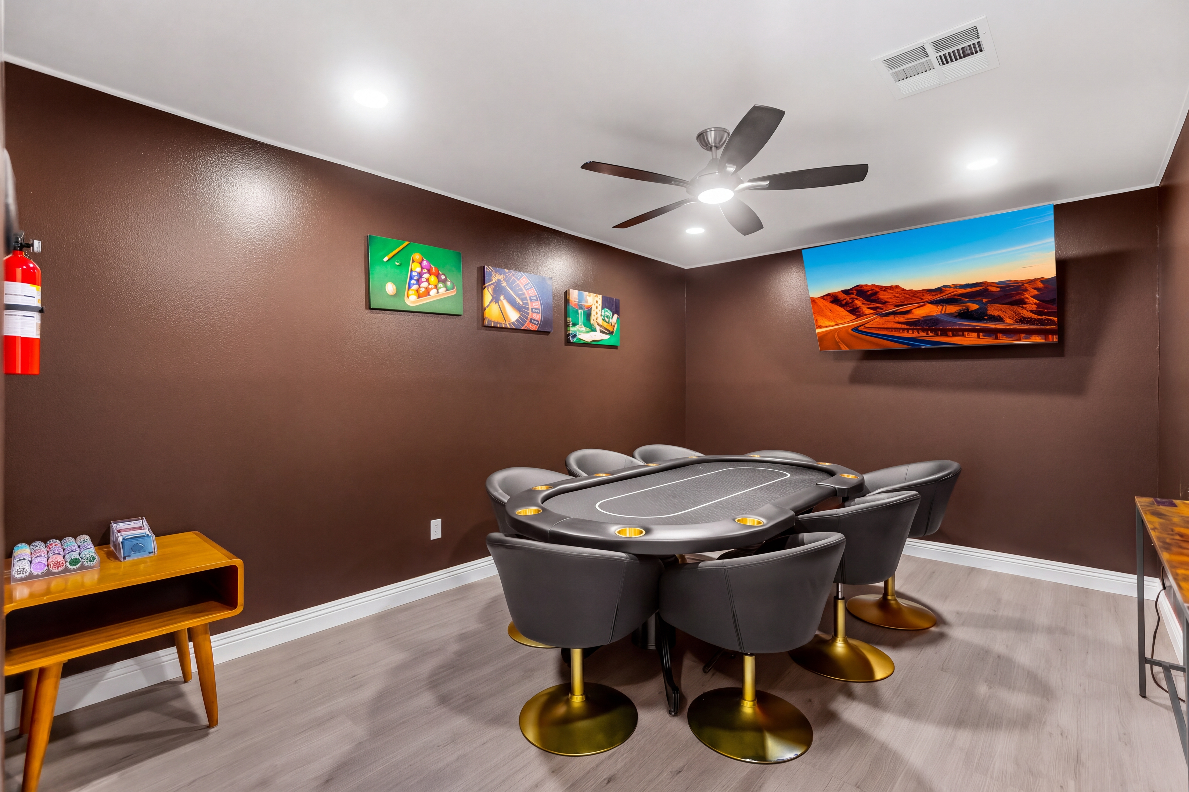 Stylish game room with poker table, TV, and comfy seating for fun nights