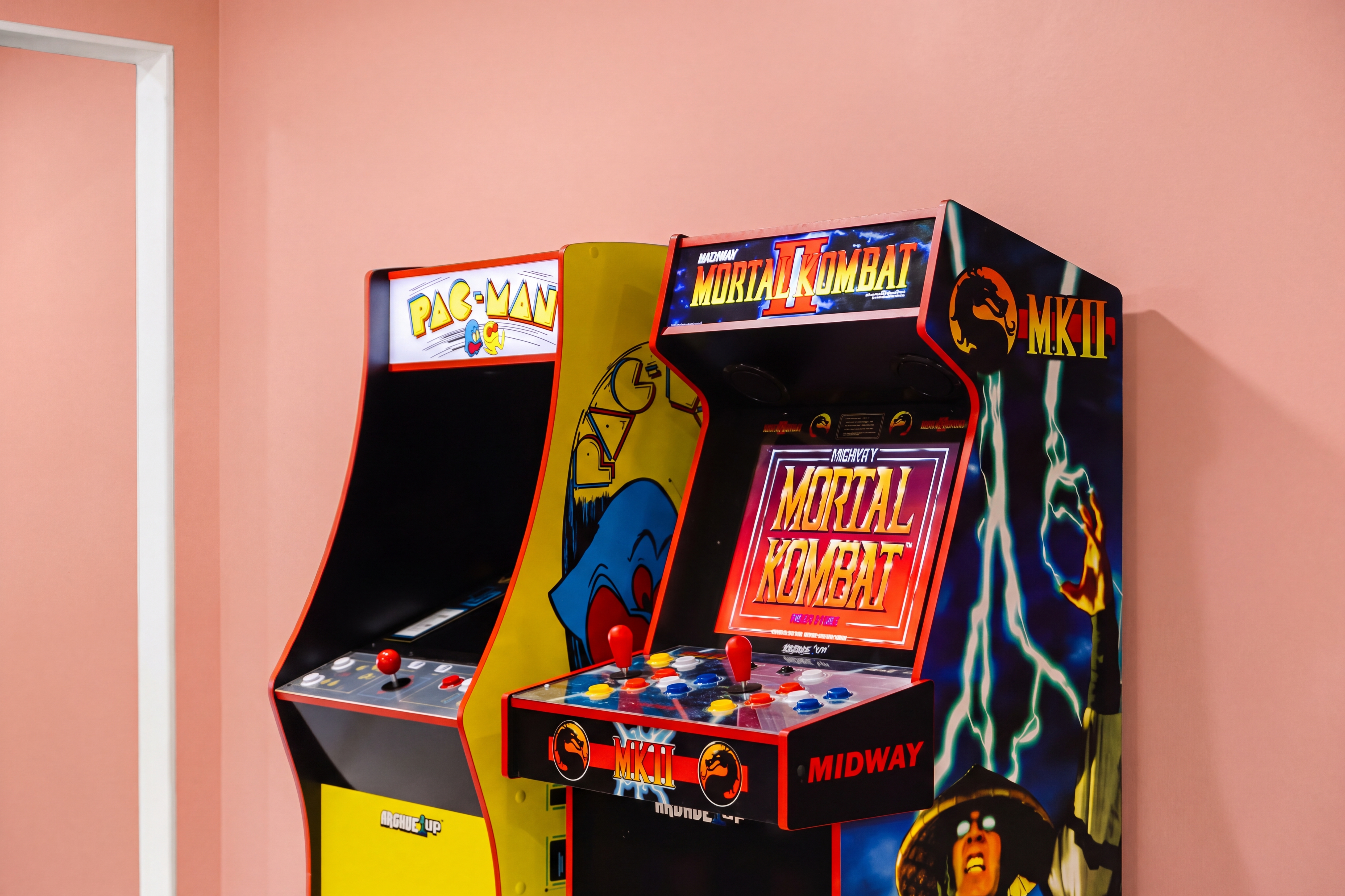 Retro arcade corner with Pac-Man and Mortal Kombat II fun