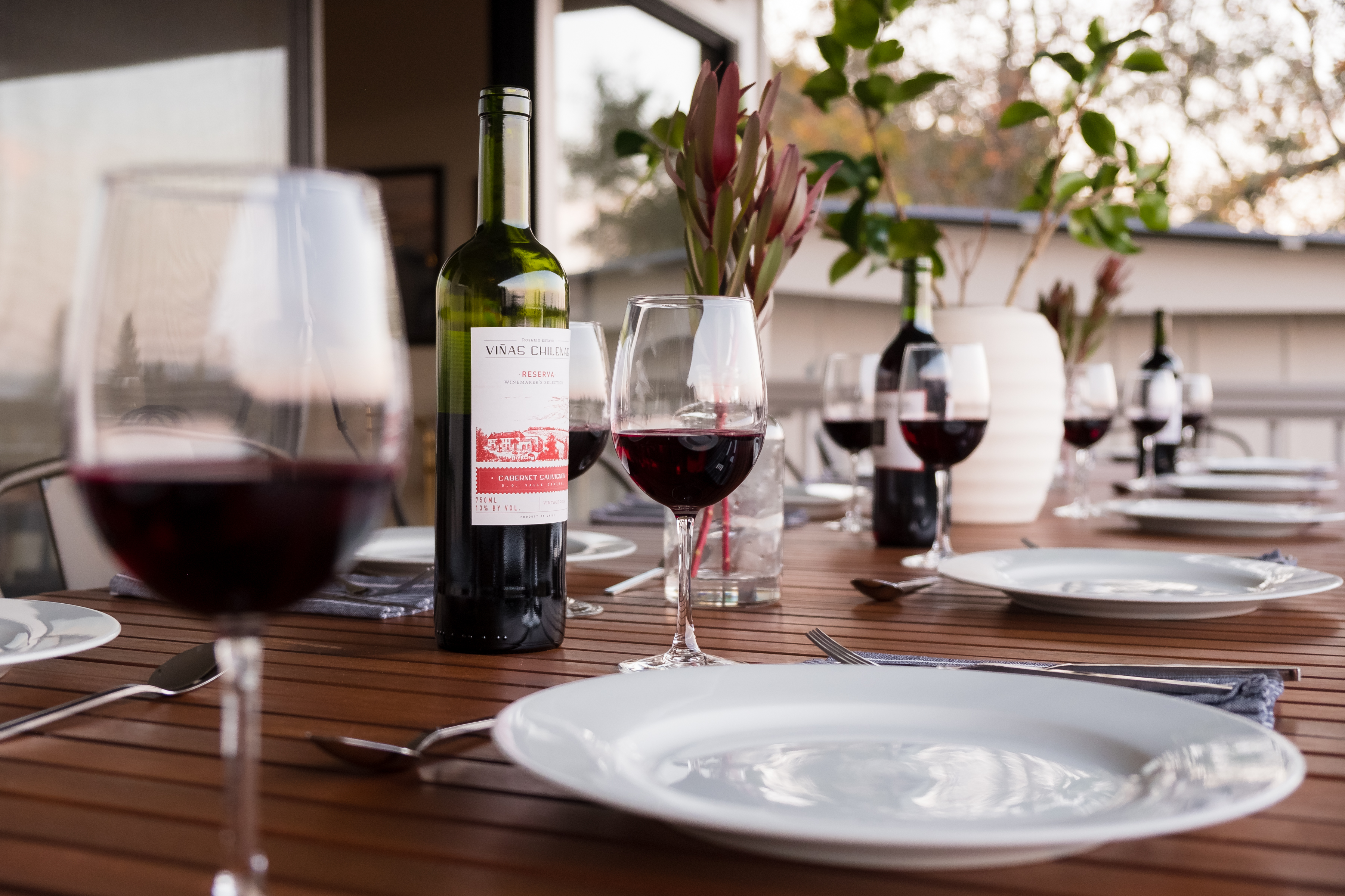 Elegant patio dining setup with wine for relaxed outdoor evenings