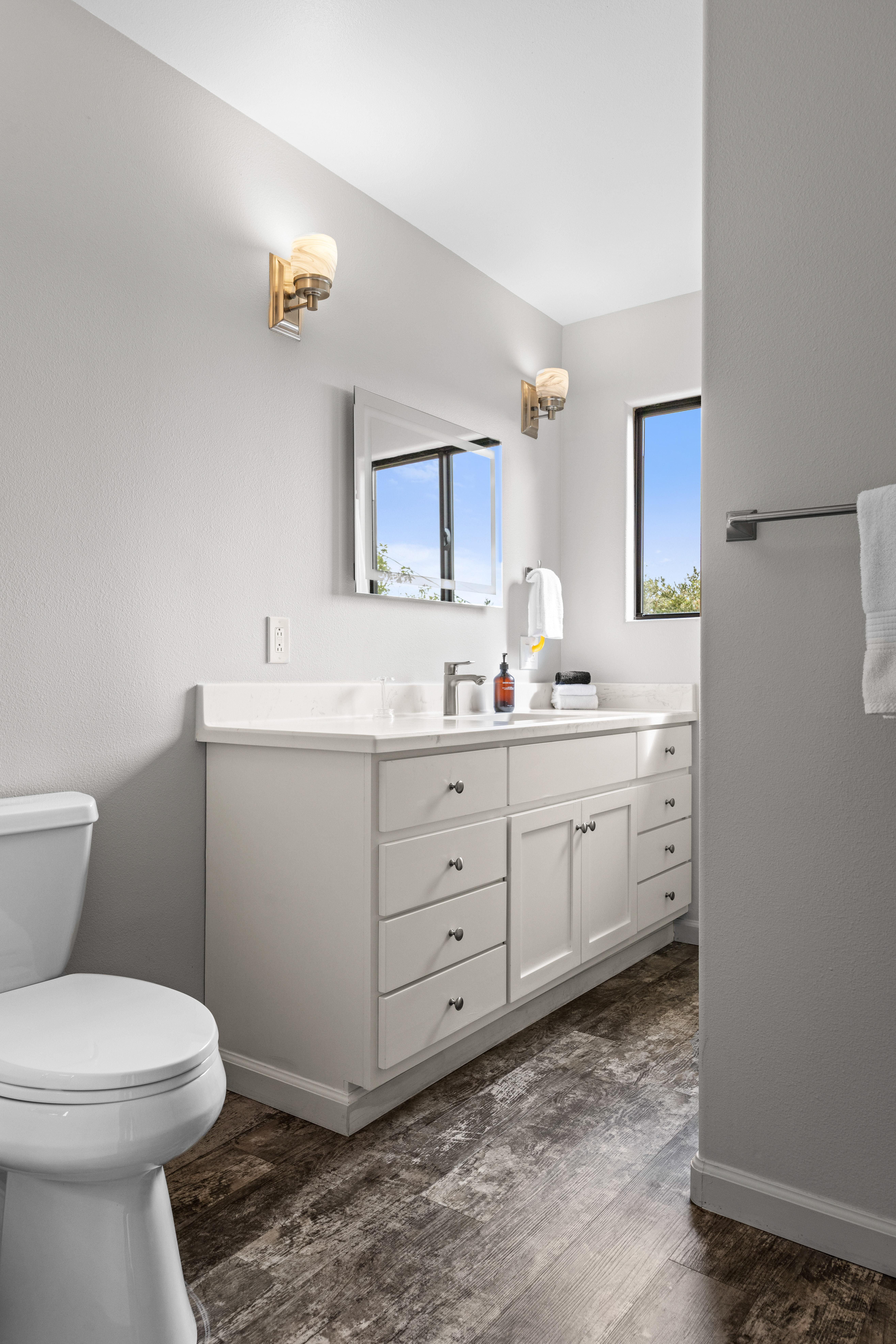 Bright modern bathroom with spacious vanity and beautiful natural light