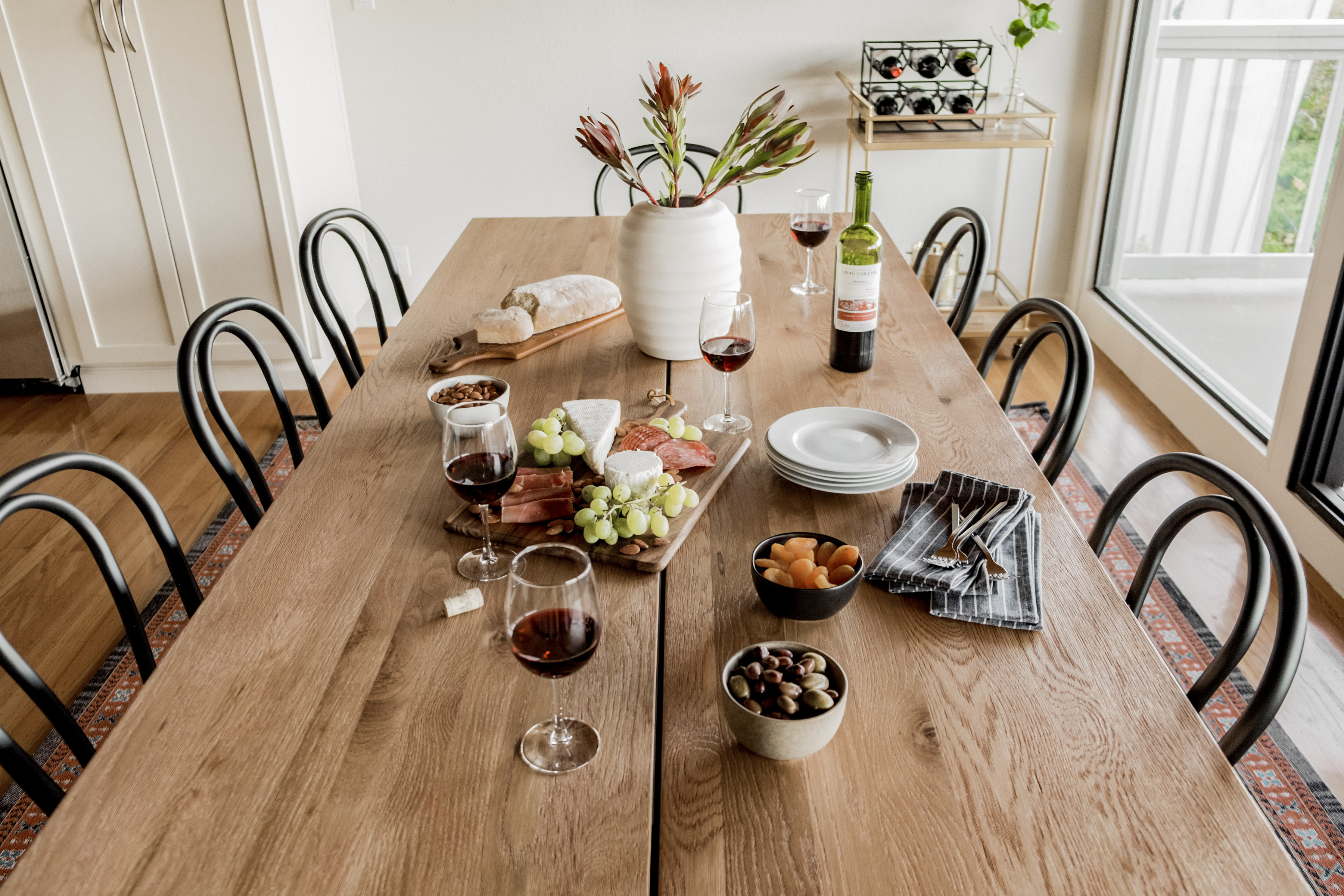 Bright dining space with a large table, natural light, and room to gather