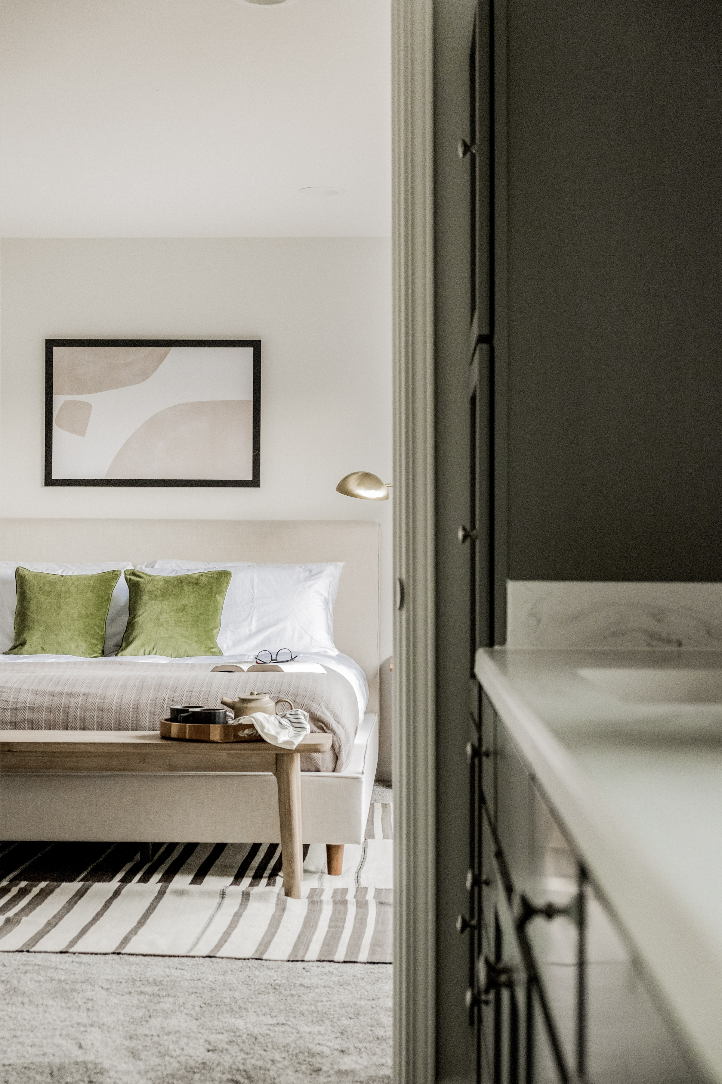 Bright, modern bedroom with luxe accents and a sleek studio-style layout