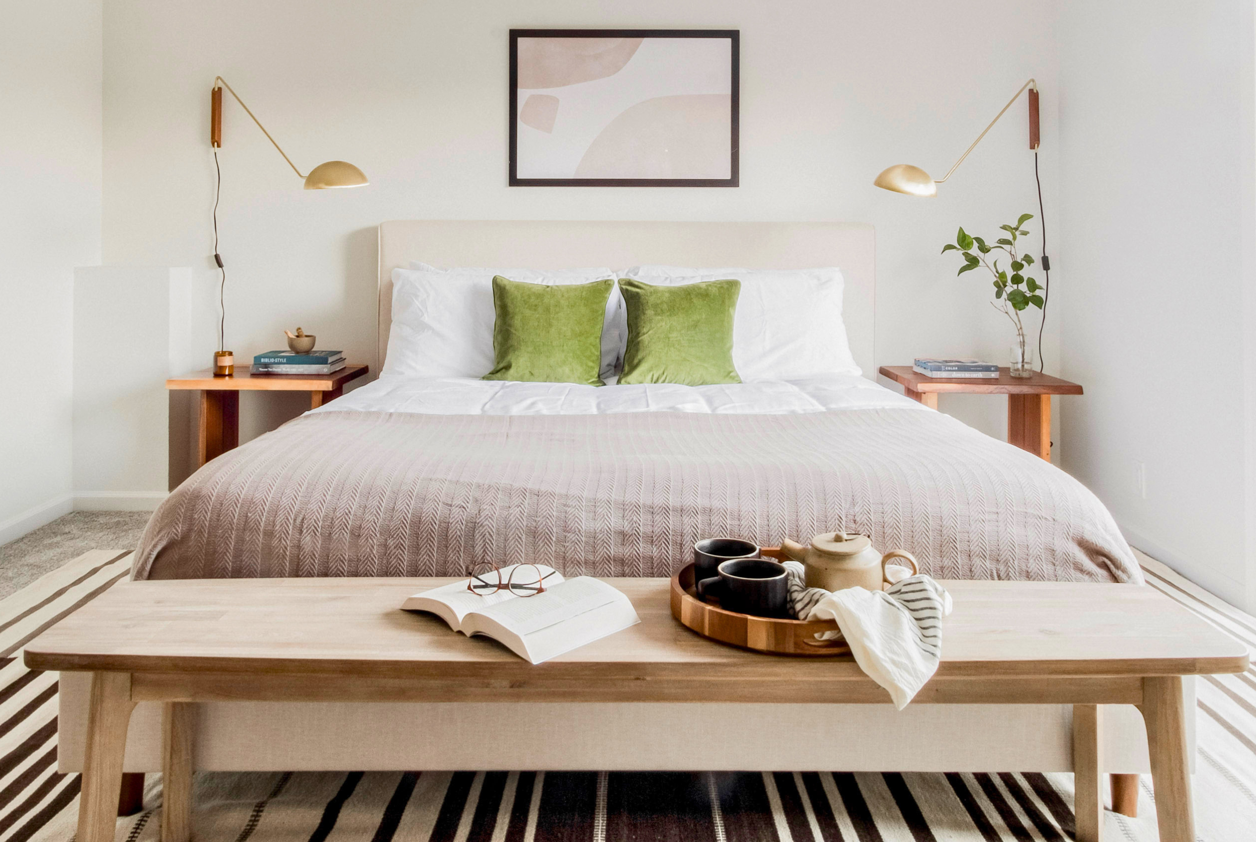Bright minimalist bedroom with cozy king bed and stylish modern touches