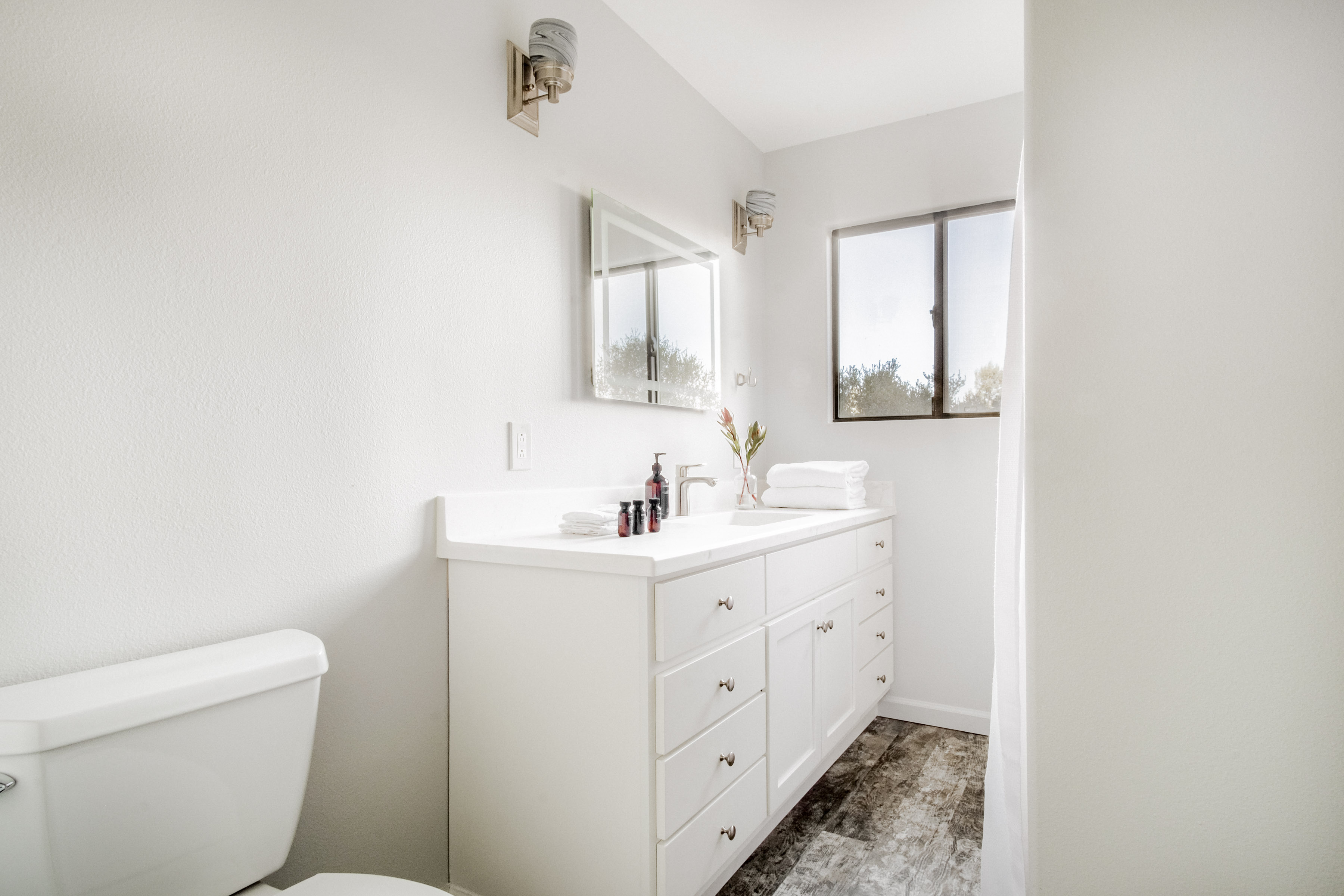 Bright modern bathroom with natural light and spacious vanity