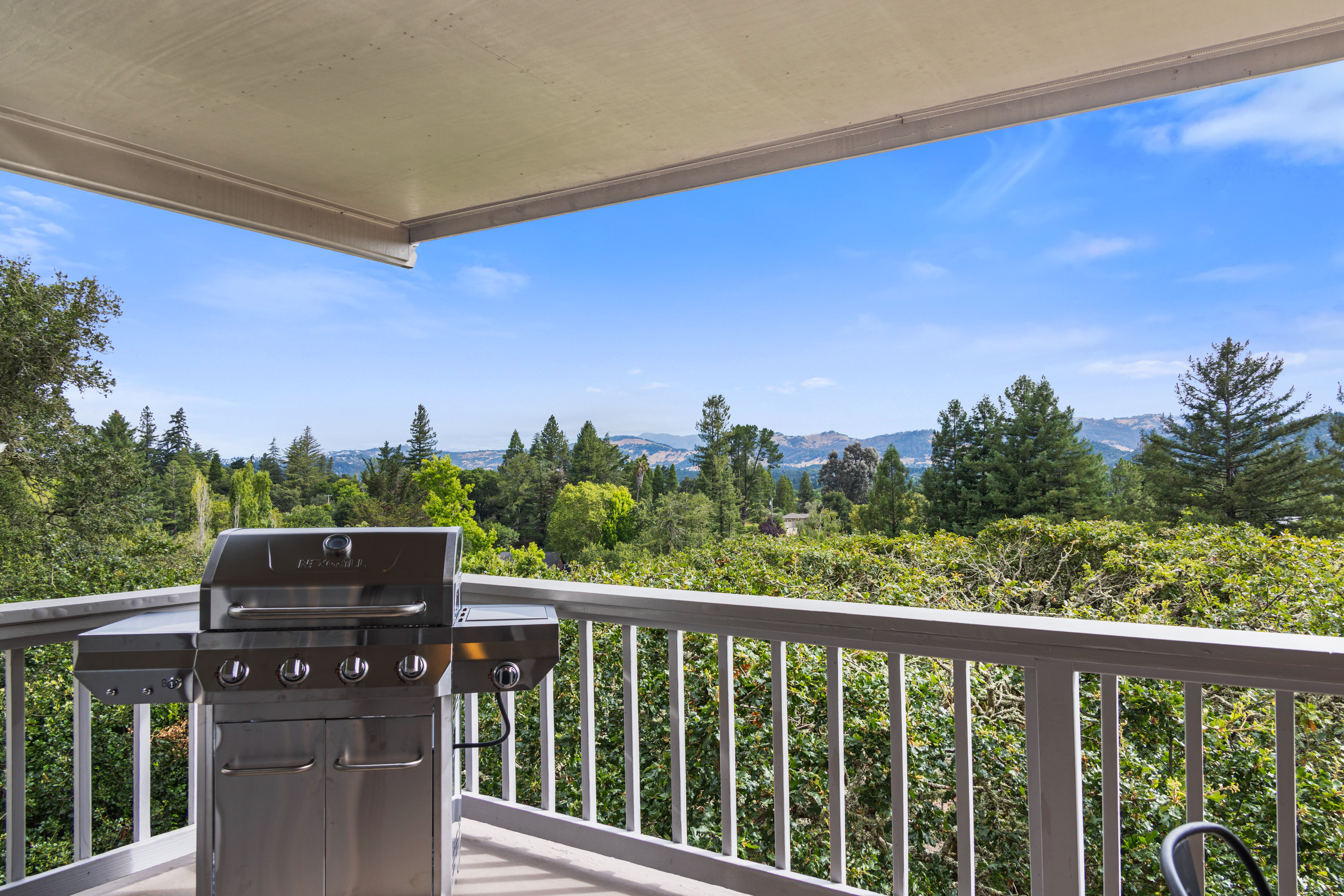 Covered view deck with BBQ and beautiful mountain vistas