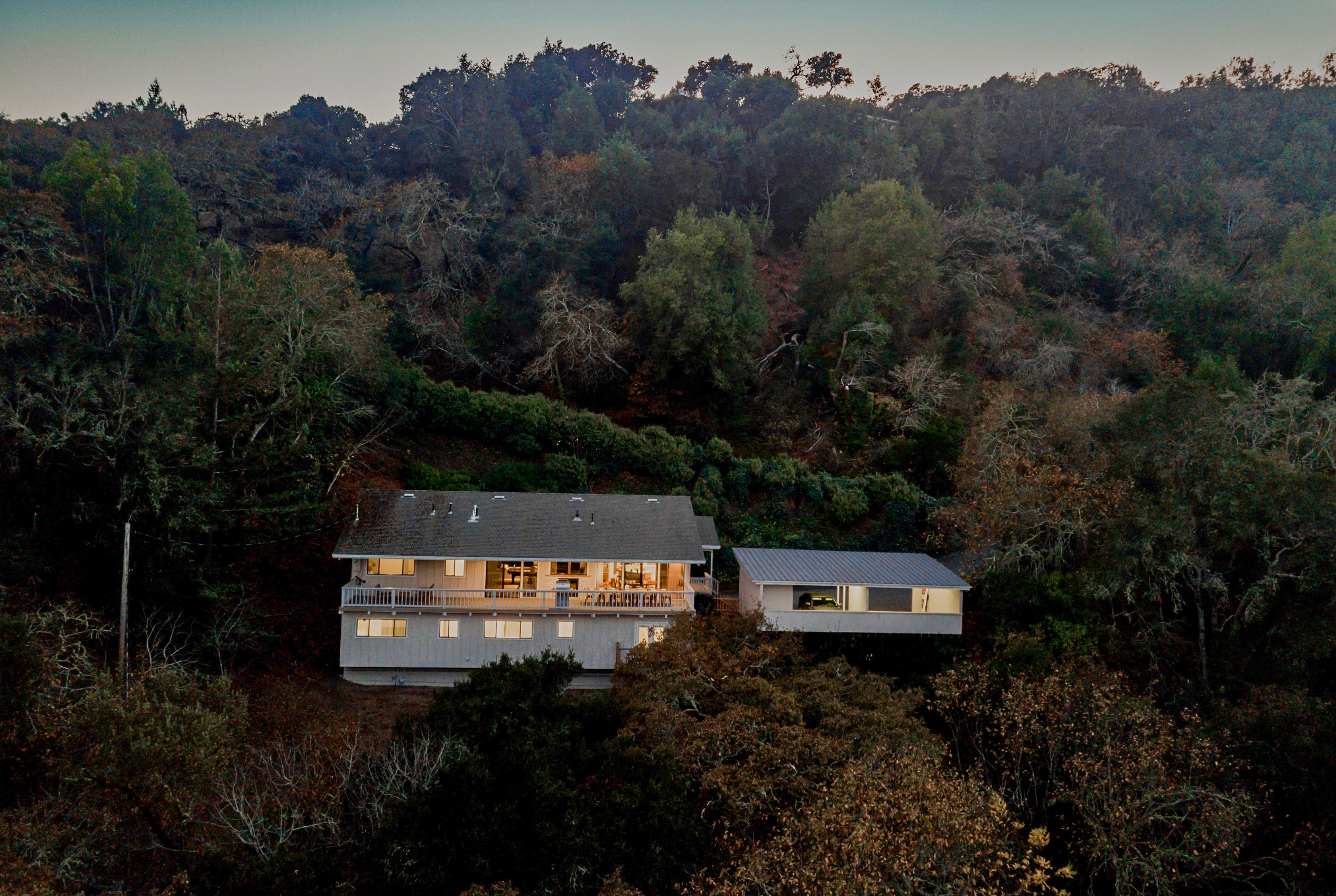 Secluded hillside retreat with forest views and a spacious deck