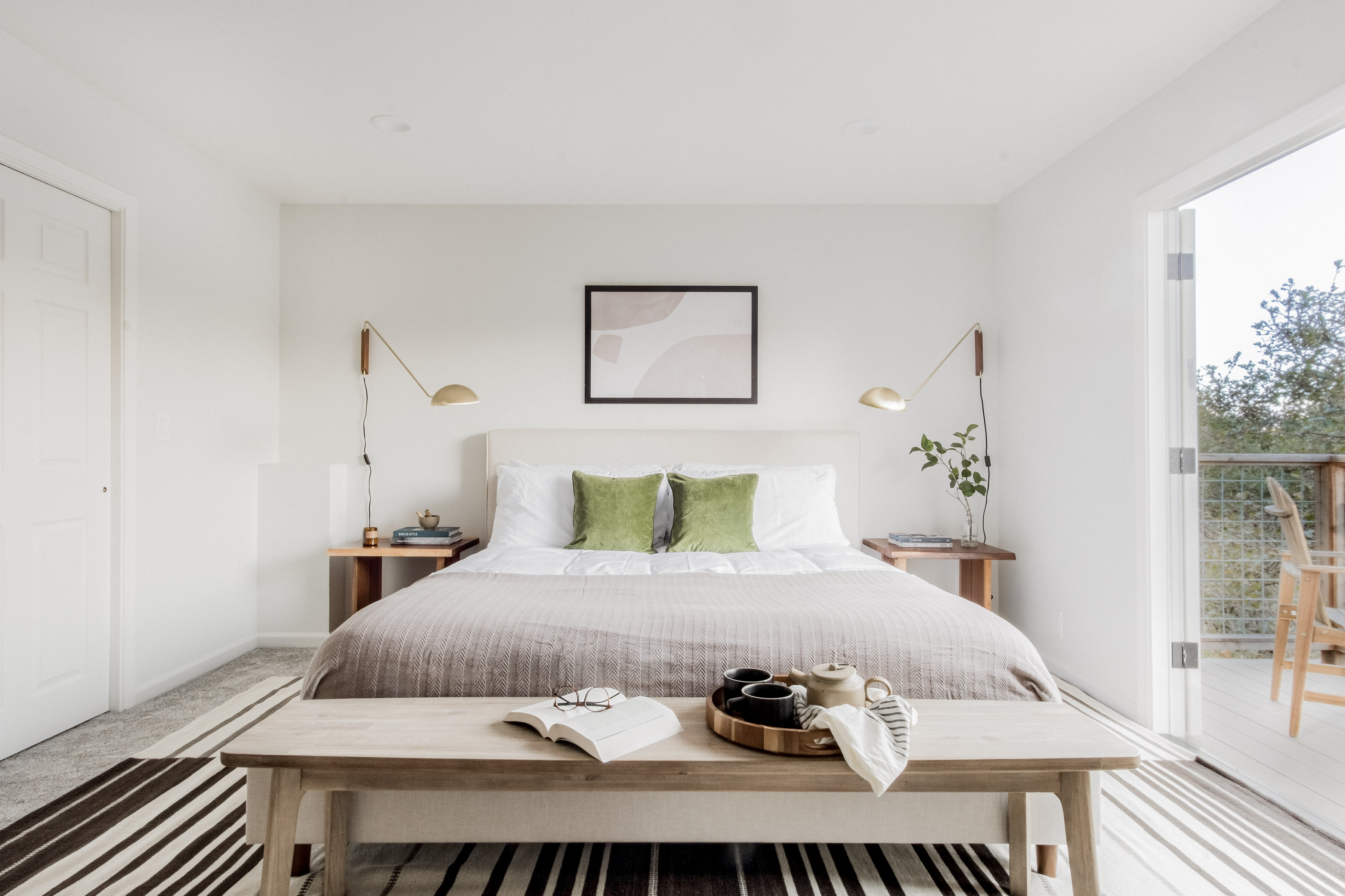 Bright, serene bedroom with private balcony access and abundant natural light