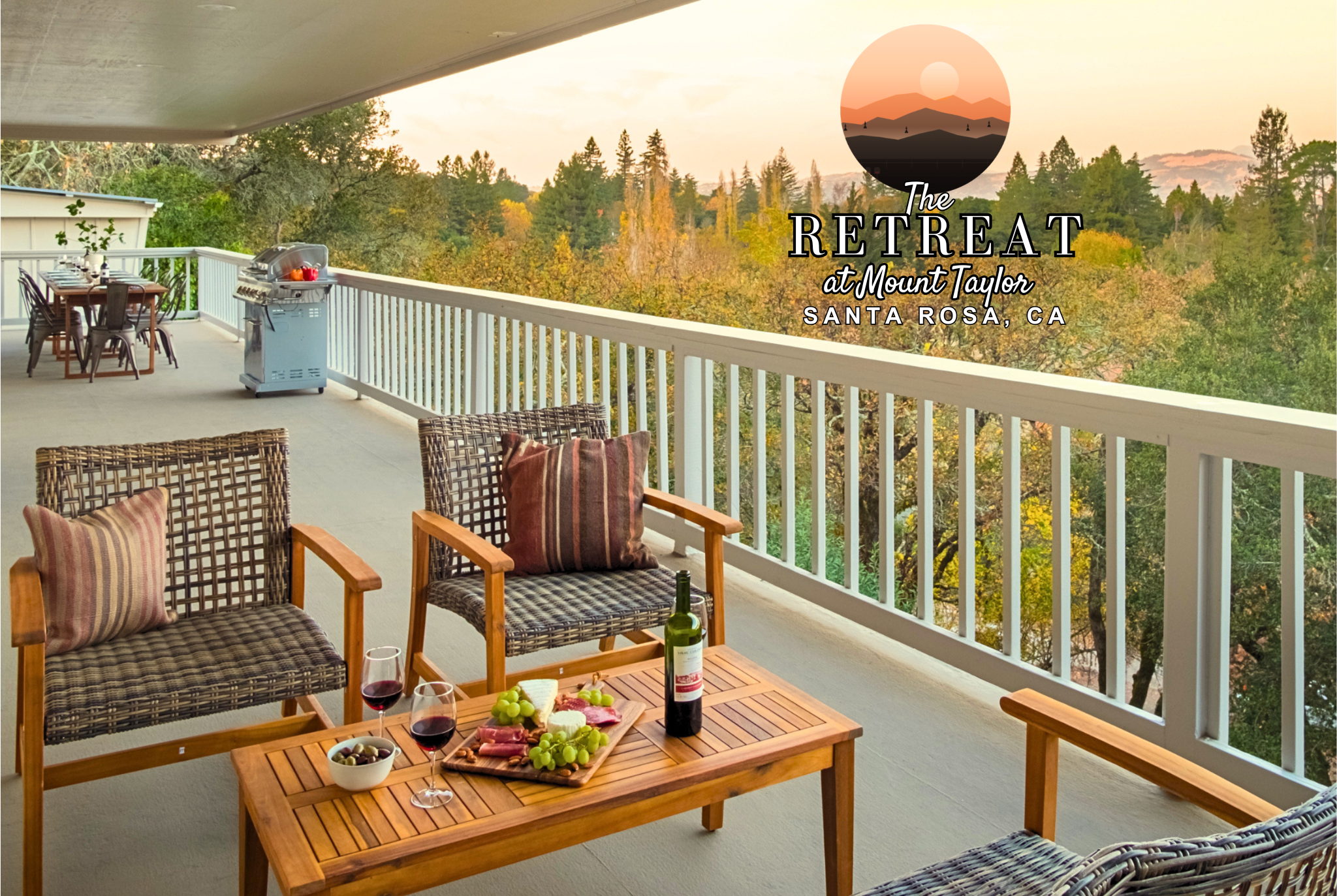 Covered scenic balcony with lounge seating, grill, and tranquil treetop views
