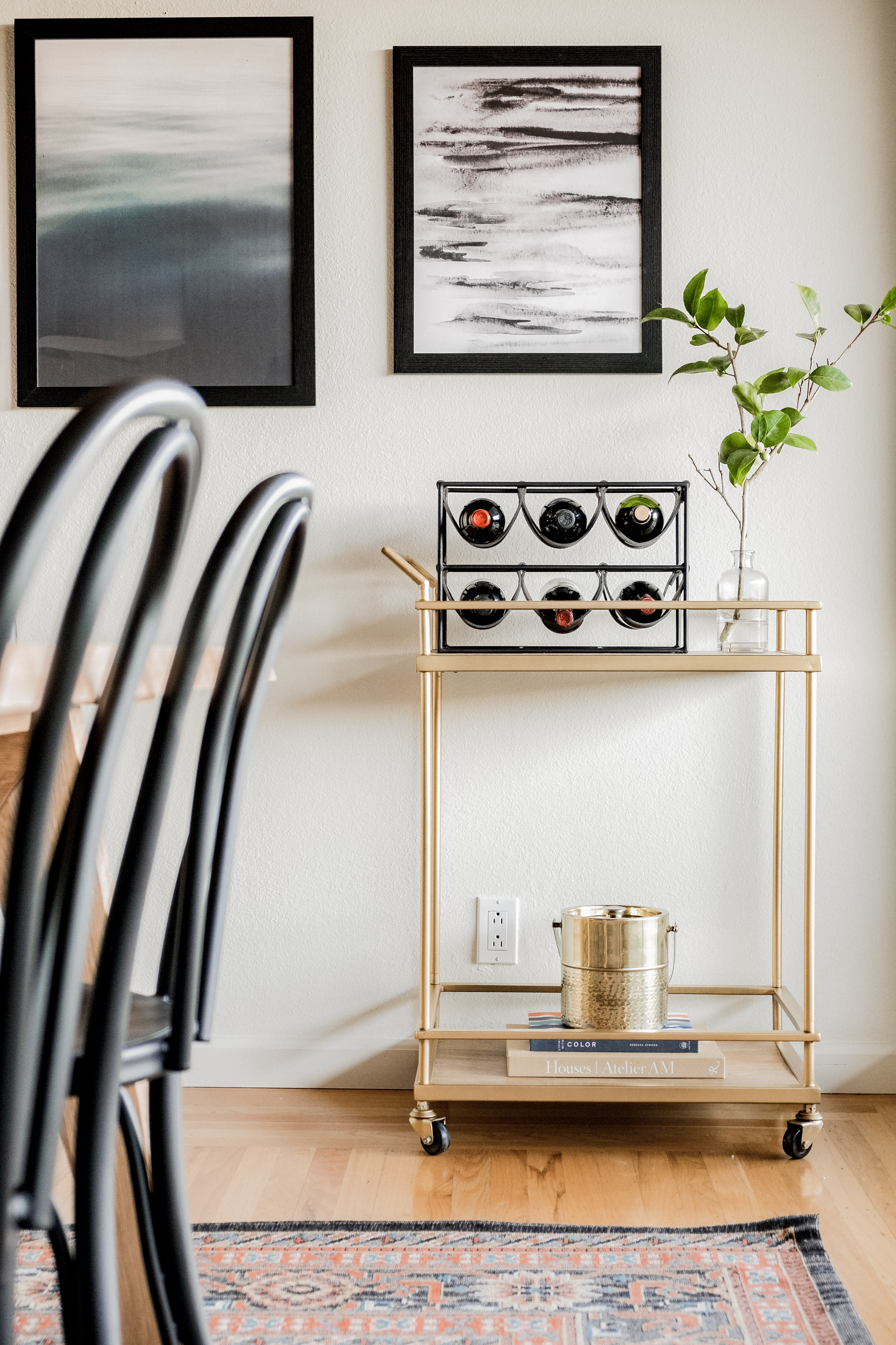 Chic dining nook with bar cart, wine storage, and modern decor