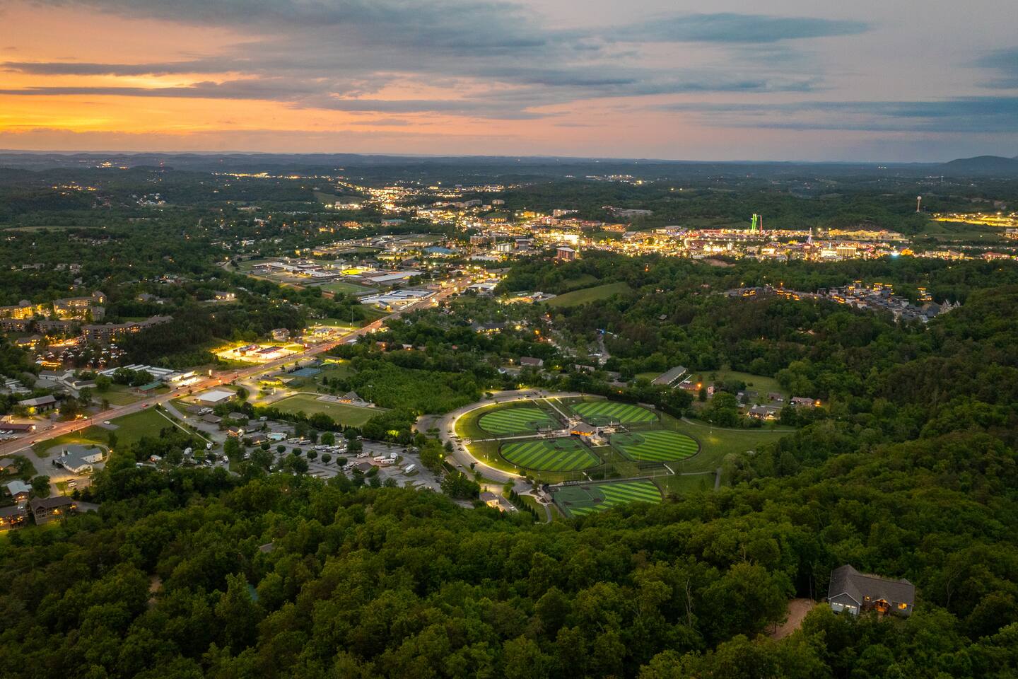 Drone photo from above the cabin and looking towards the Pigeon Forge strip. The PF strip is a short 7-minute drive away from the cabin!