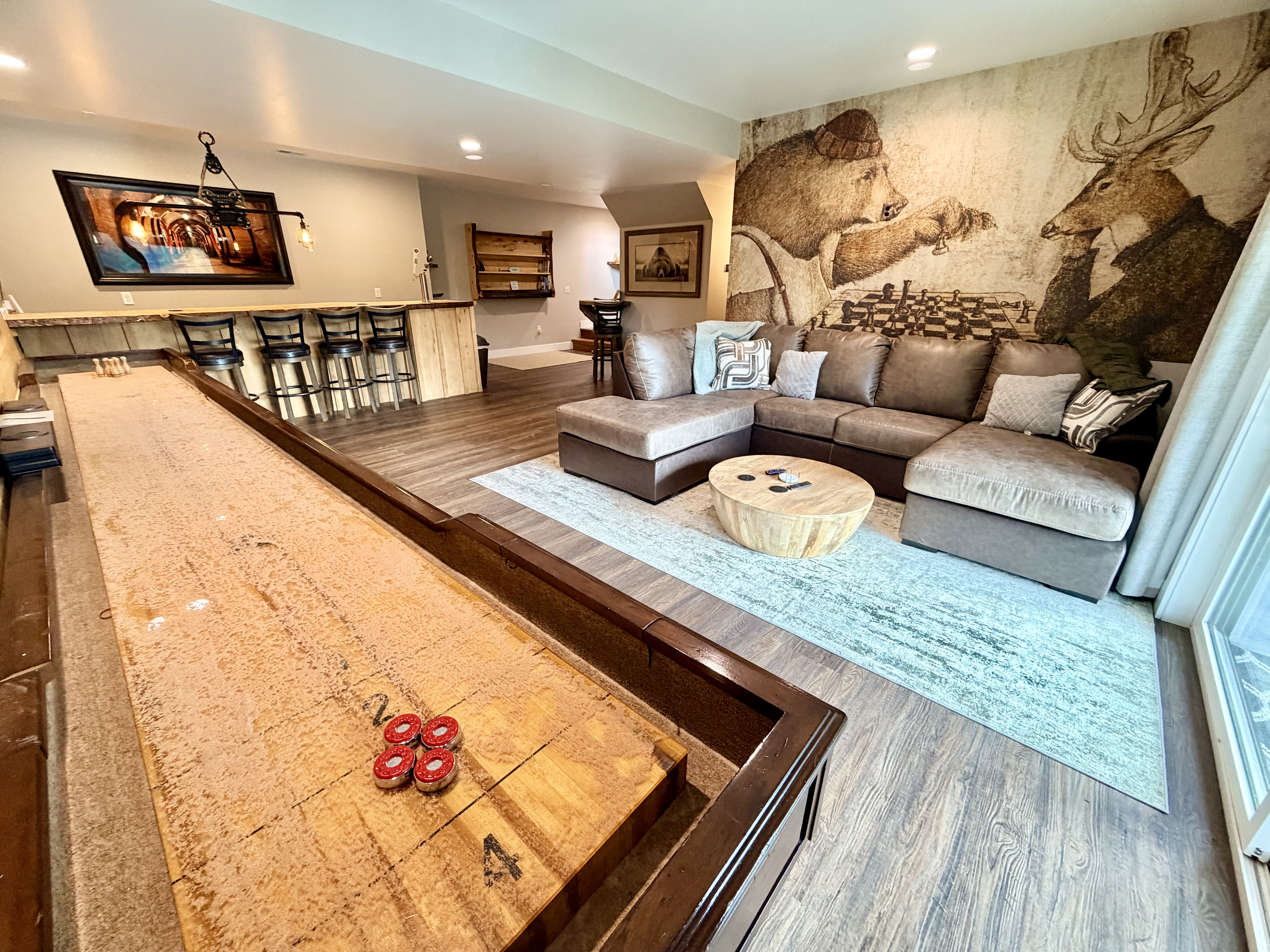Game room with shuffleboard and full bar