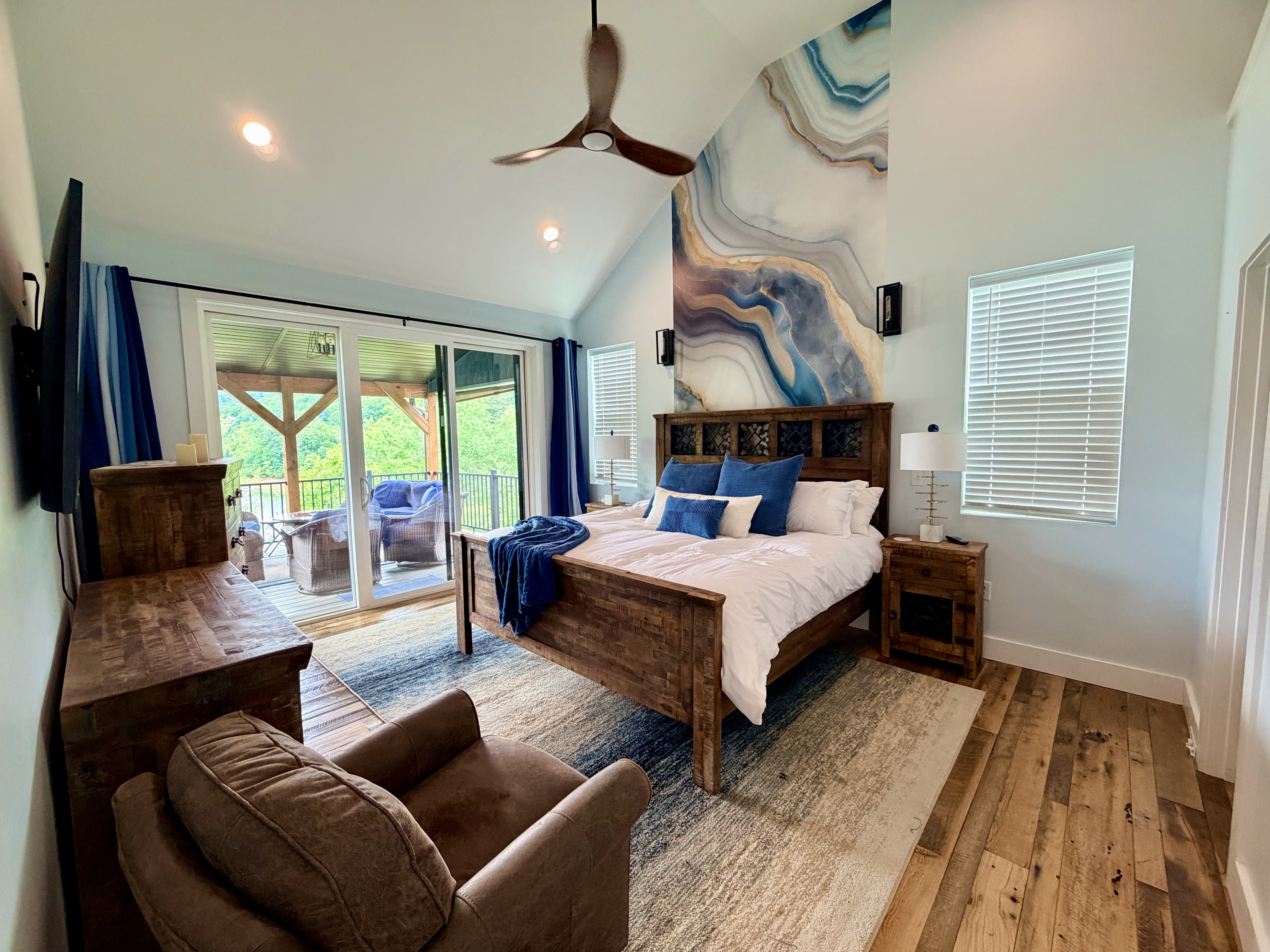 Vaulted king bedroom with private balcony