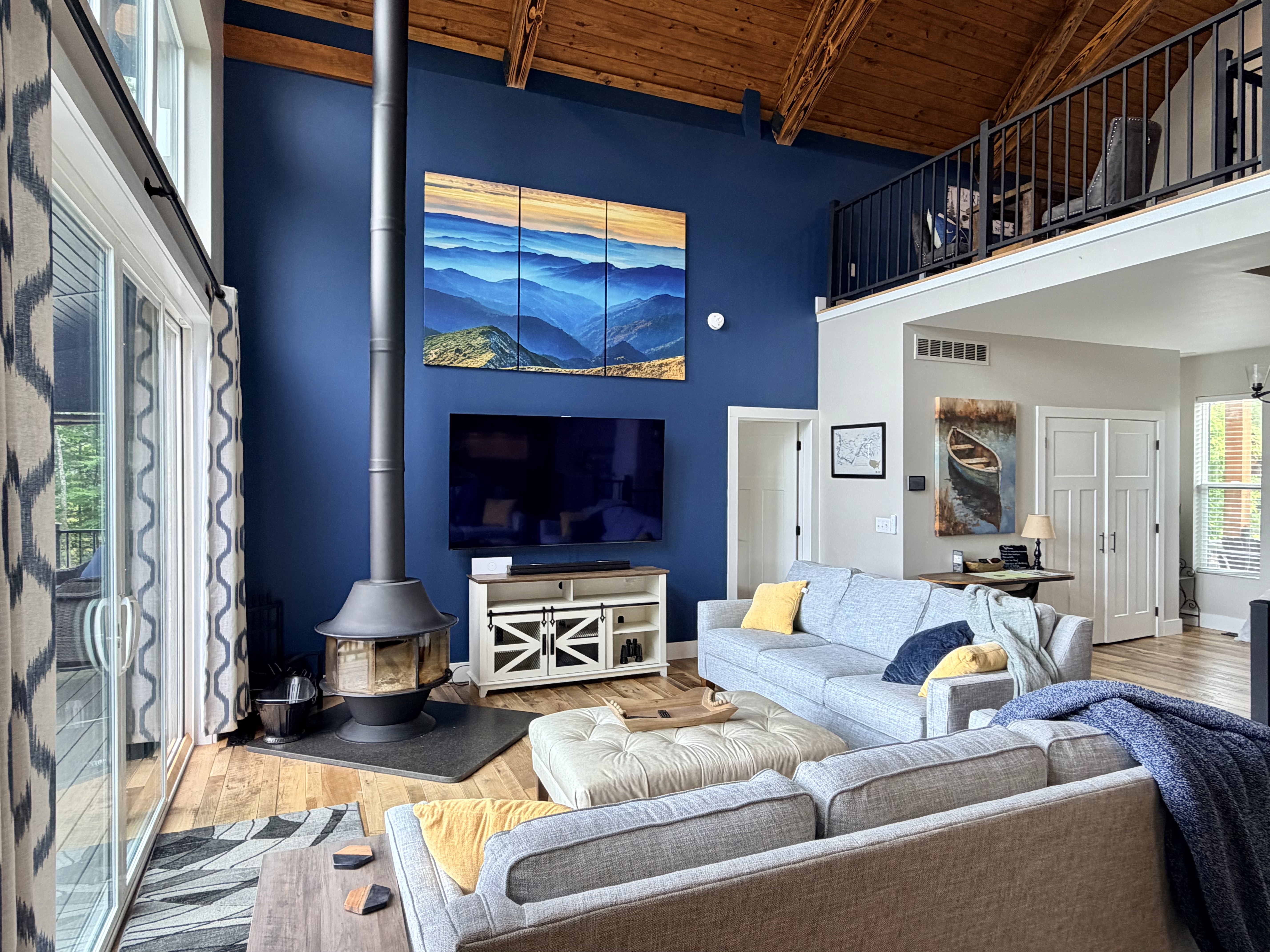 Vaulted living room with loft and fireplace