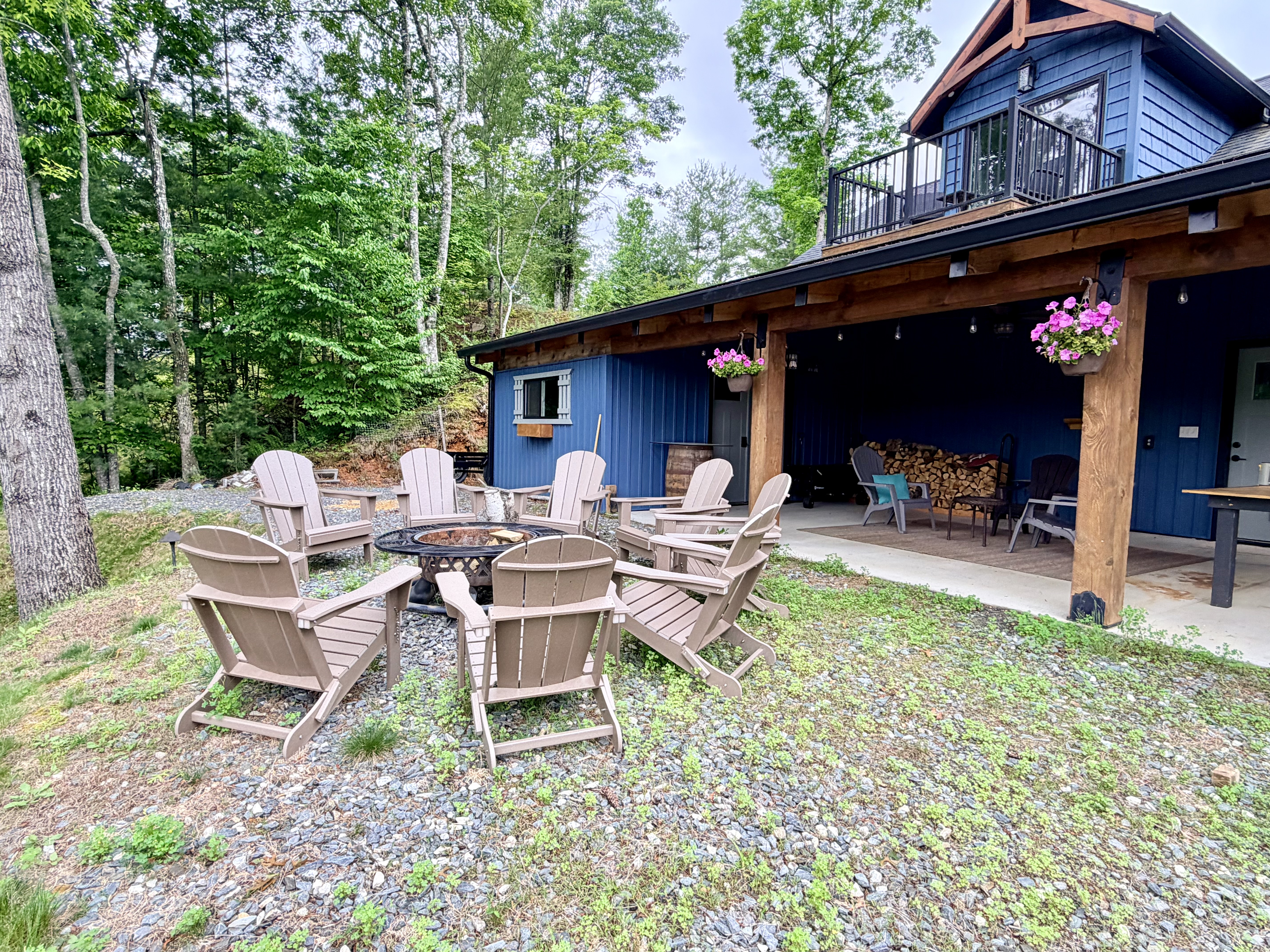 Woodland cabin with fire pit at dusk