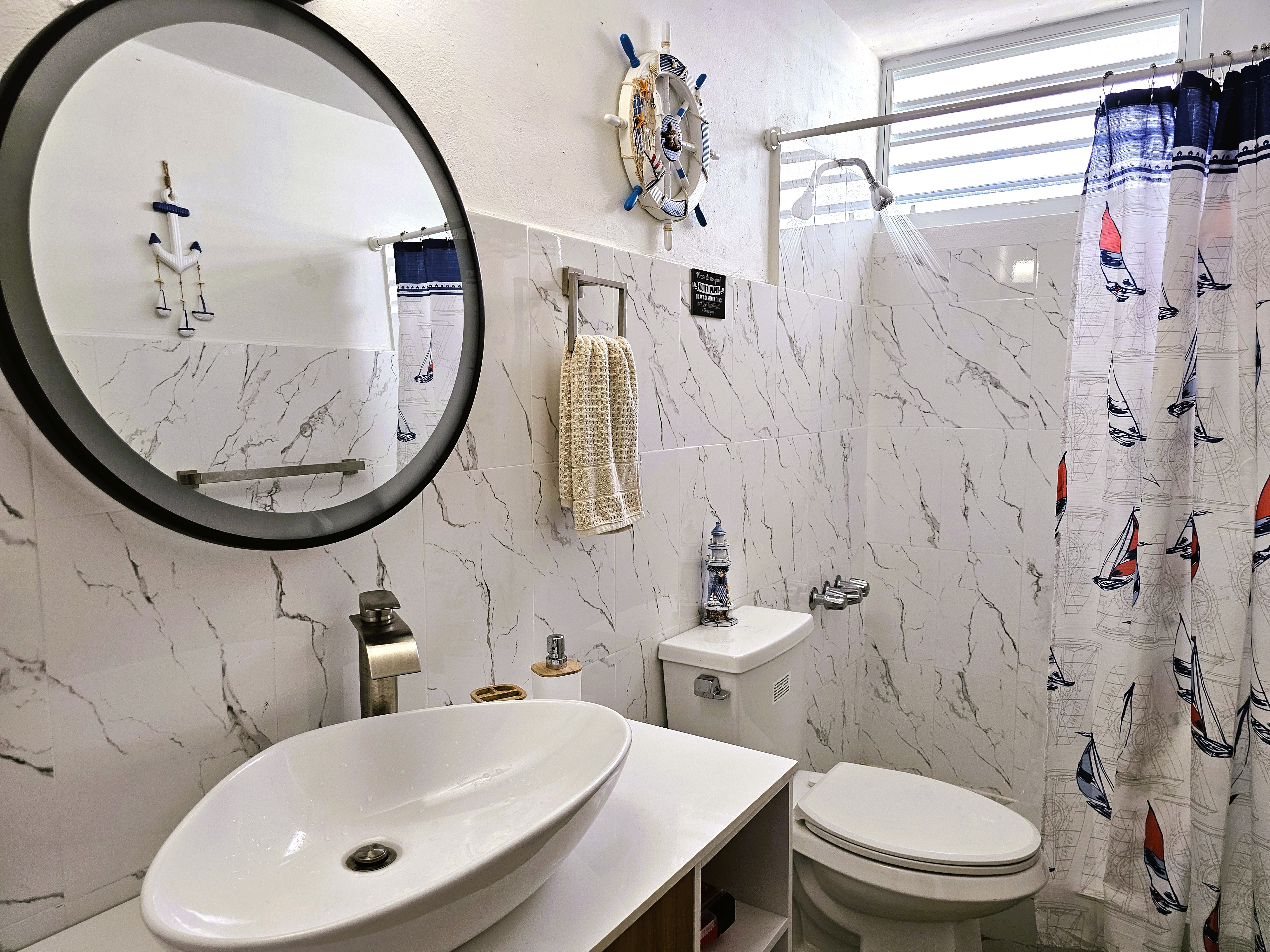 Bright coastal-style bathroom with modern finishes and natural light