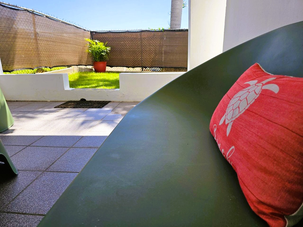 Private patio with lounge seating and a sunny garden touch