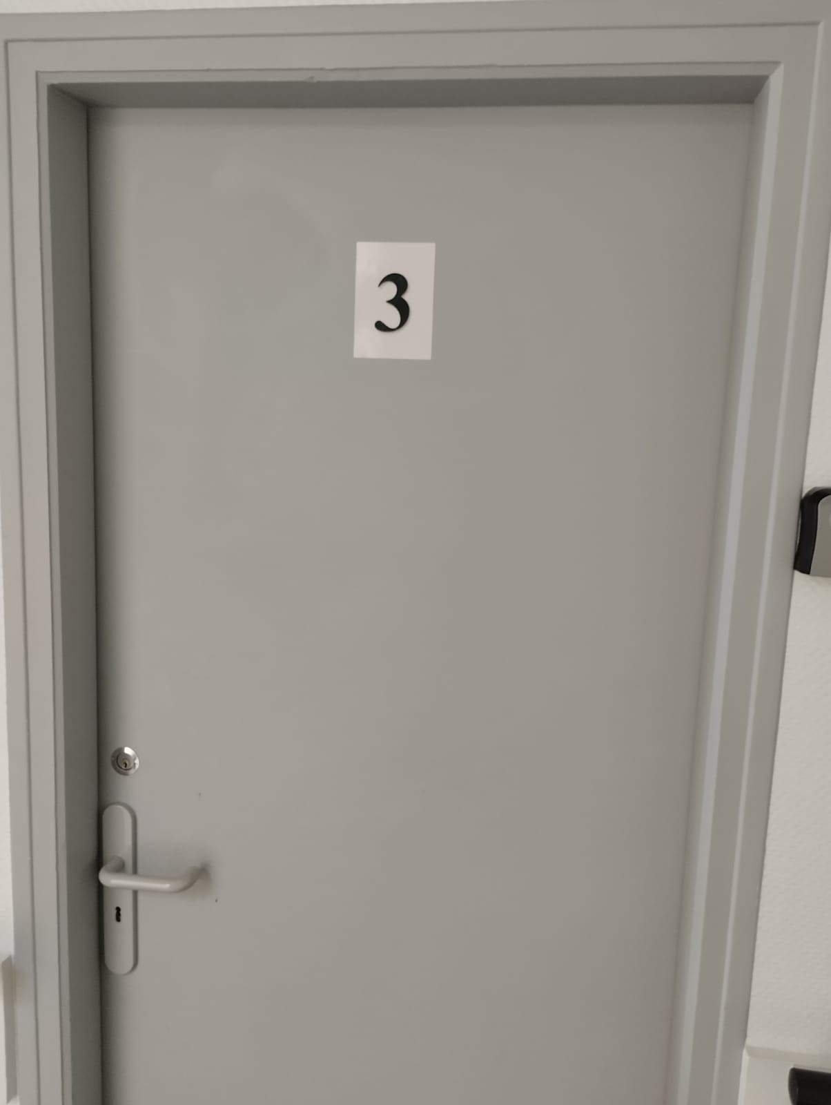 Clearly marked private room entrance with a clean, modern look