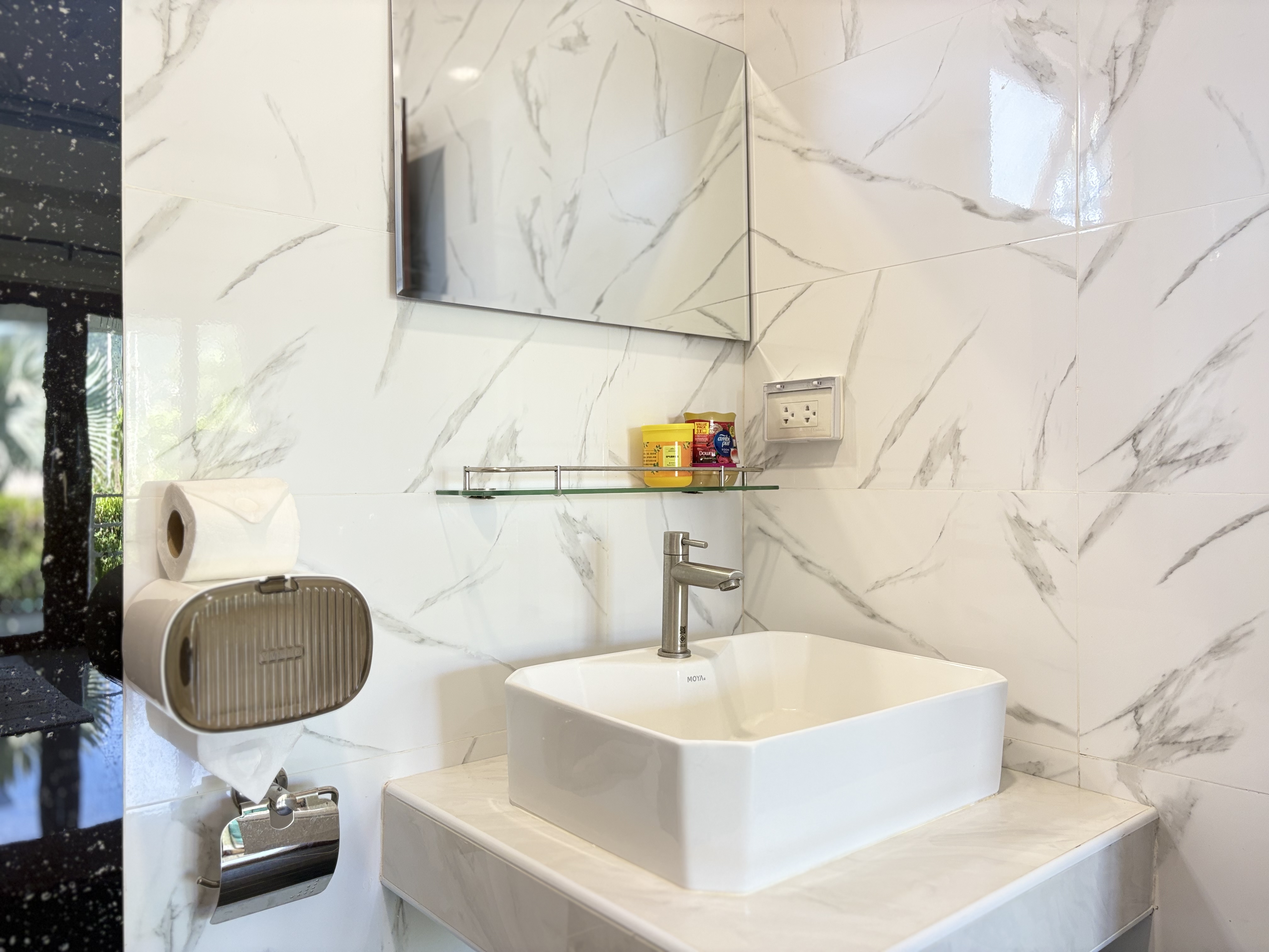Modern marble bathroom with sleek vessel sink and stylish finishes