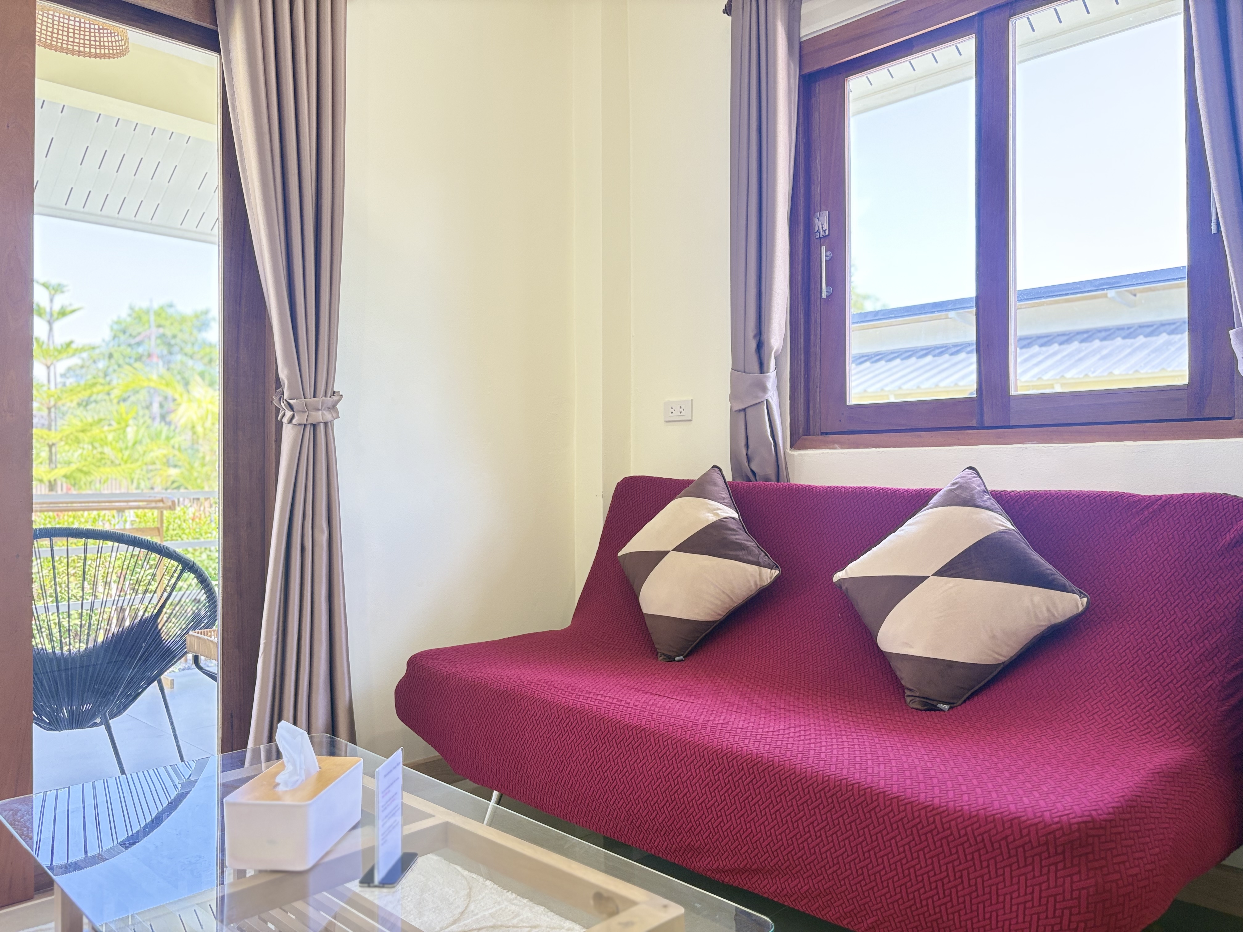 Bright lounge corner with balcony access and relaxing natural light