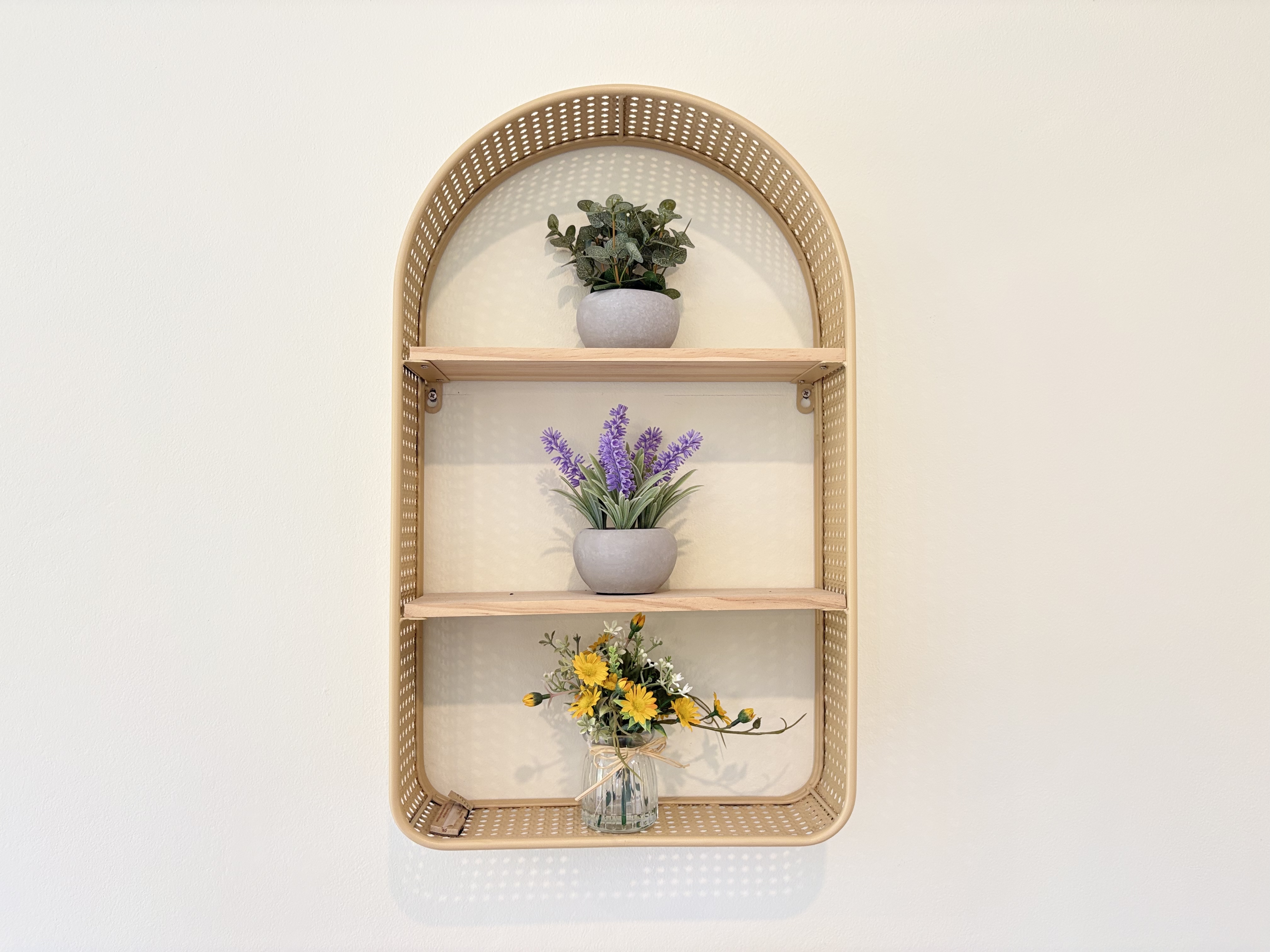 Charming arched wall shelf with fresh florals and modern styling