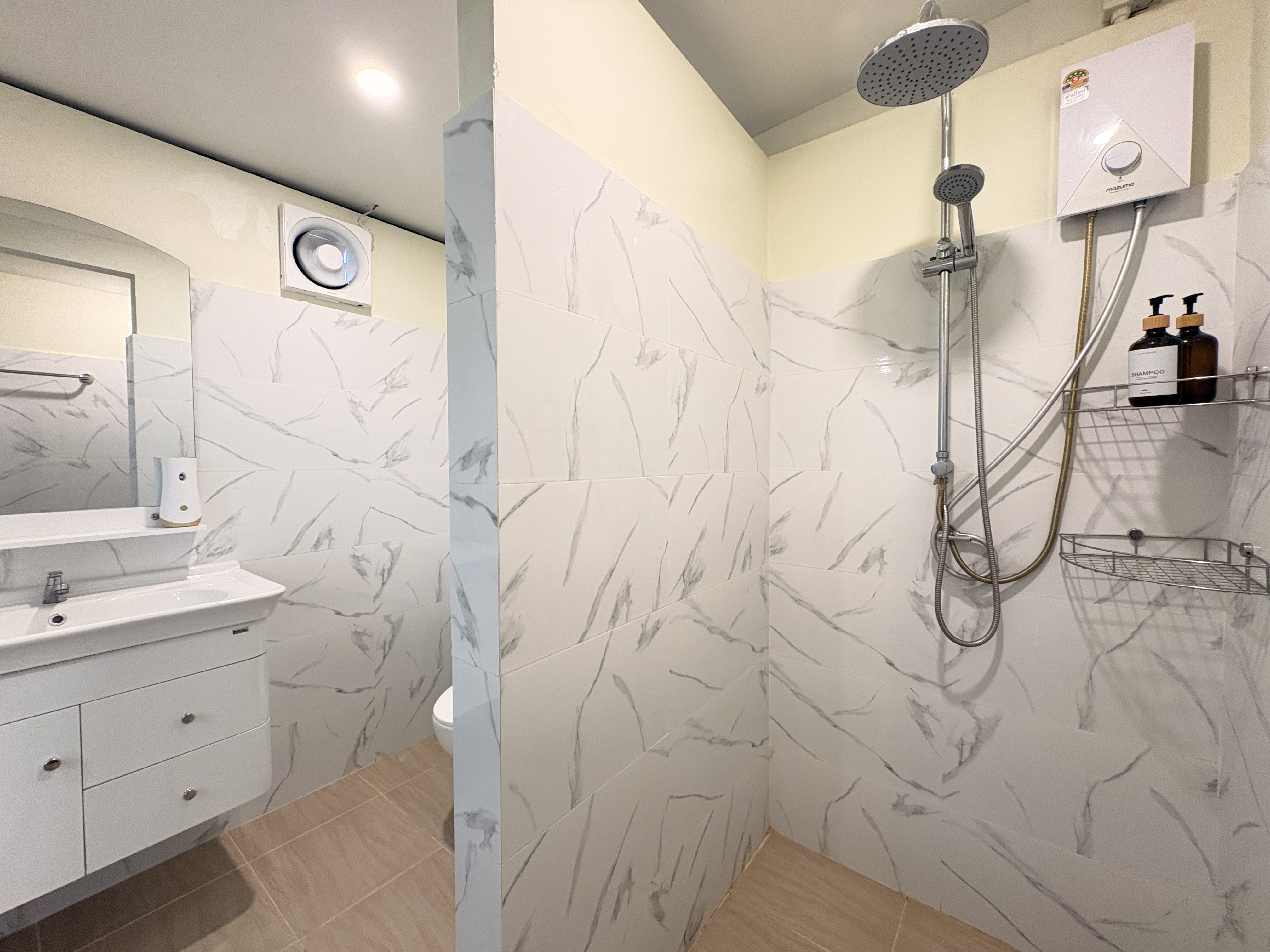 Modern bathroom with marble-look walk-in rain shower