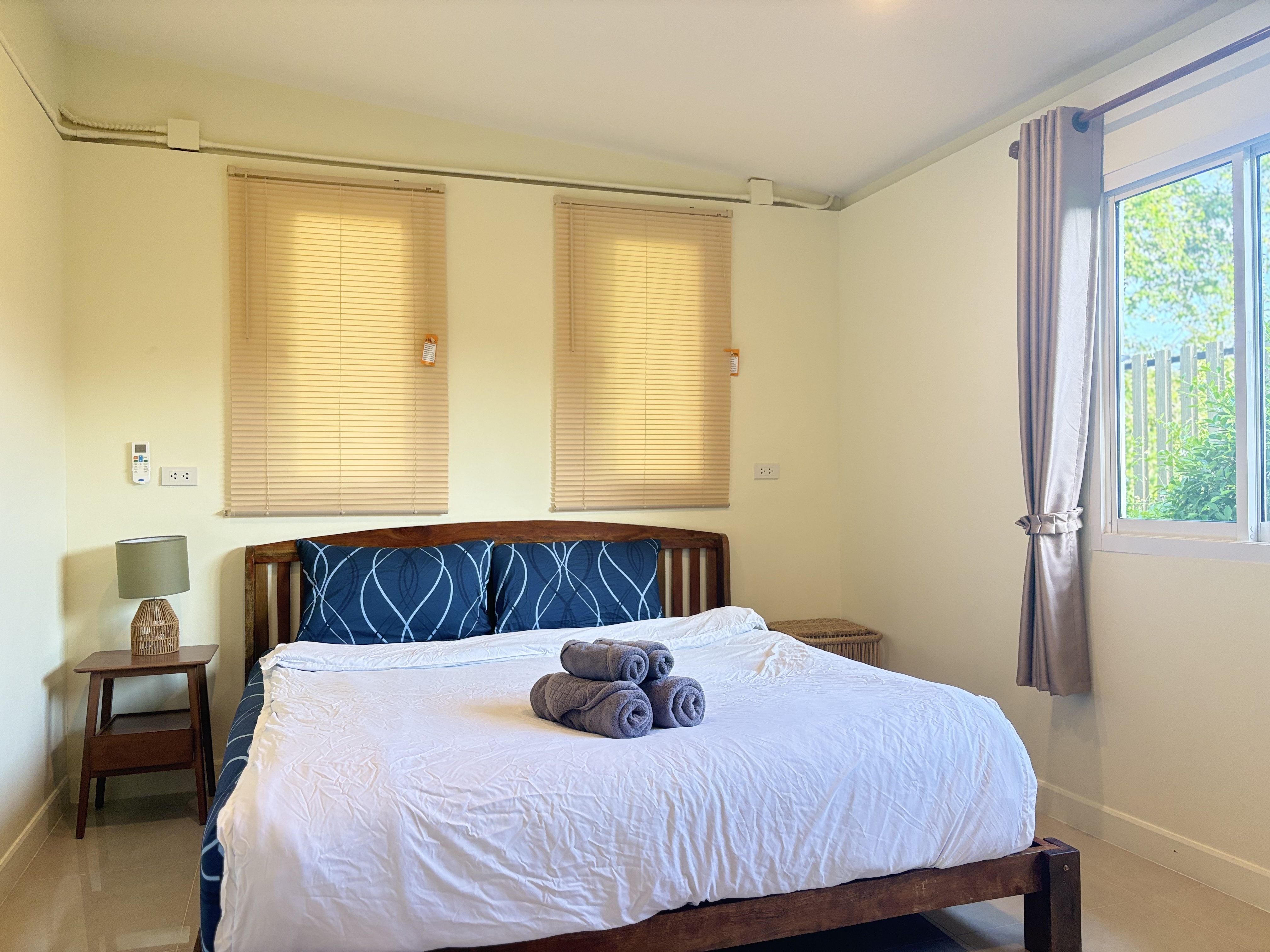 Bright, cozy bedroom with natural light and a welcoming guest-ready setup