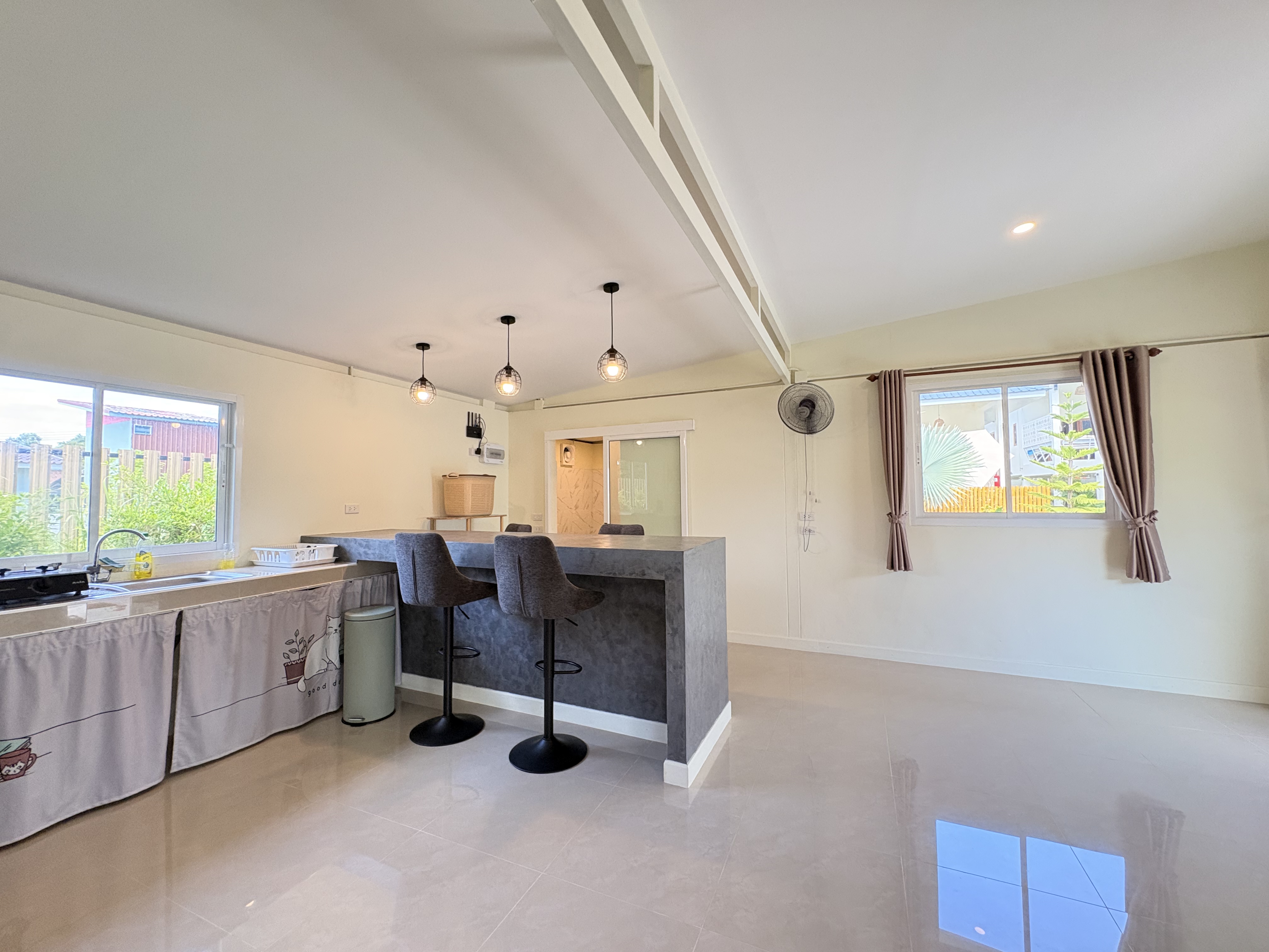Bright open-plan space with breakfast bar and abundant natural light