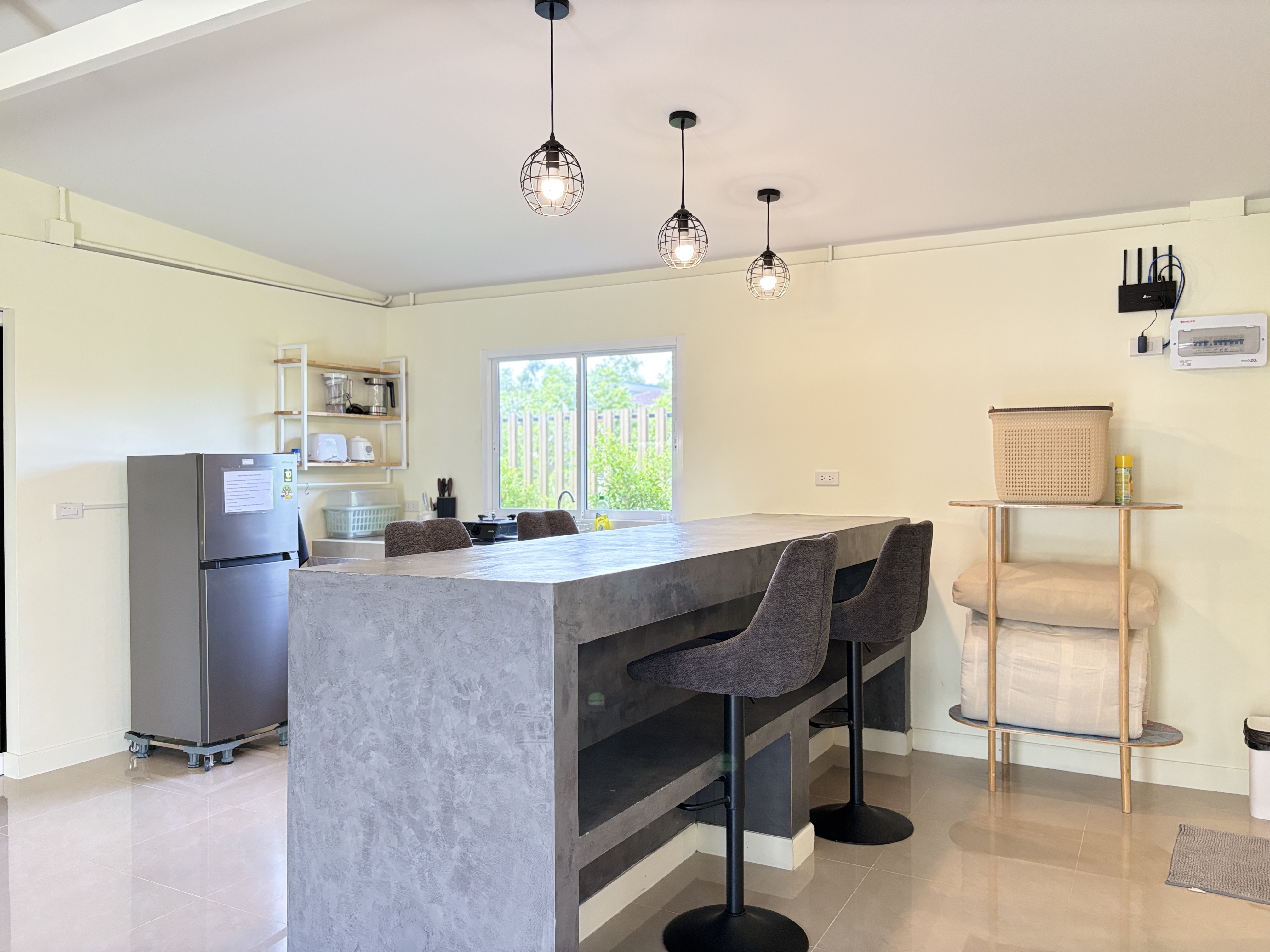Bright modern kitchen with spacious island seating and stylish lighting