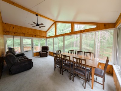 3-season sunroom with dining for 8 and lounge seating