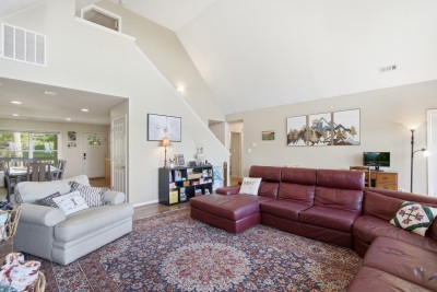Bright open living room with vaulted ceilings and plenty of seating