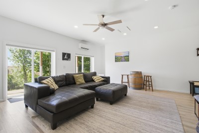Bright open living room with large sectional and natural light